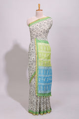 Cream warli design linen cotton saree with contrast zari border and printed blouse