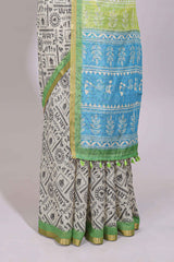 Cream warli design linen cotton saree with contrast zari border and printed blouse