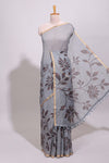 Grey floral design linen cotton saree with self zari border and contrast printed blouse