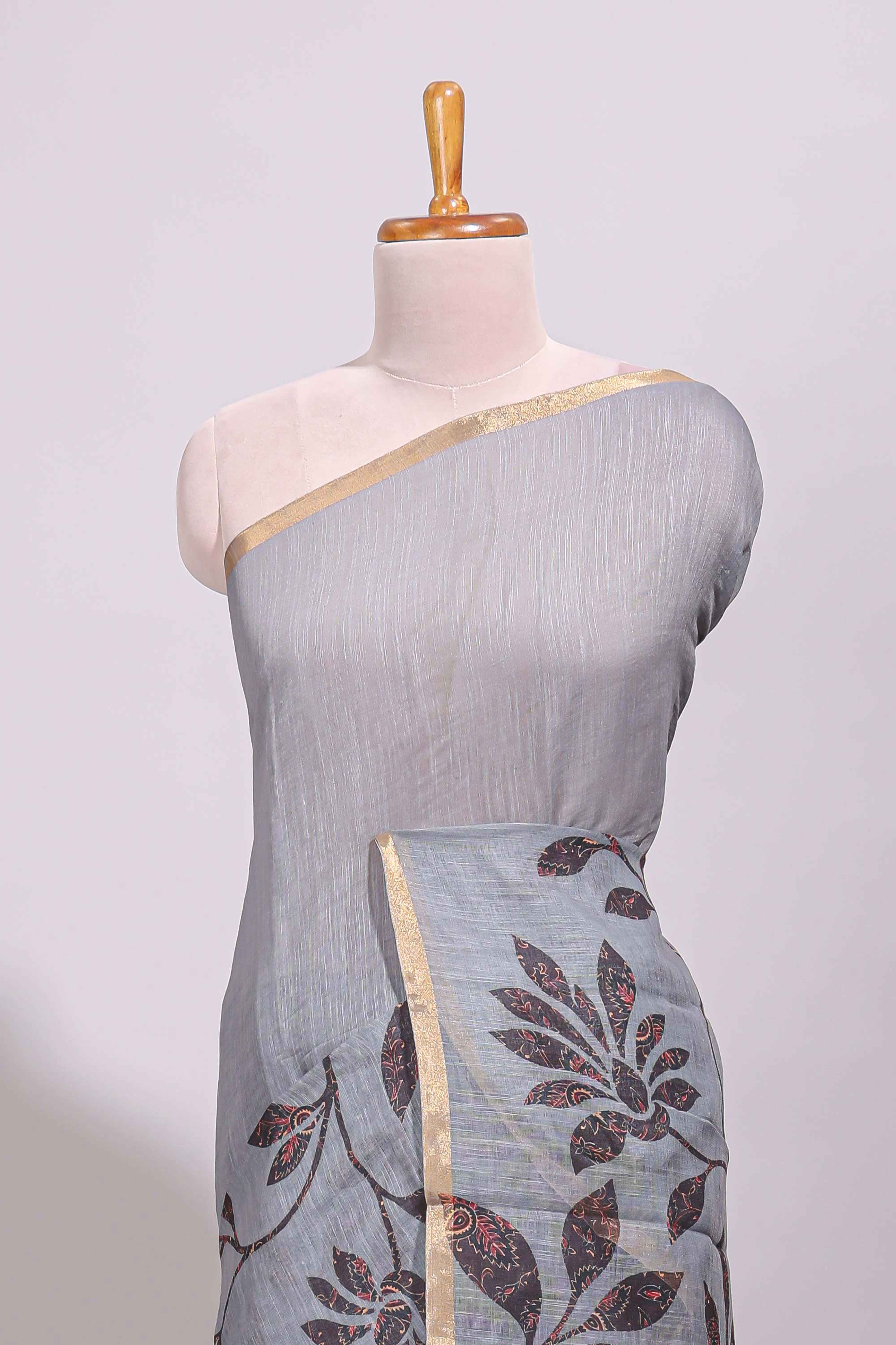 Grey floral design linen cotton saree with self zari border and contrast printed blouse