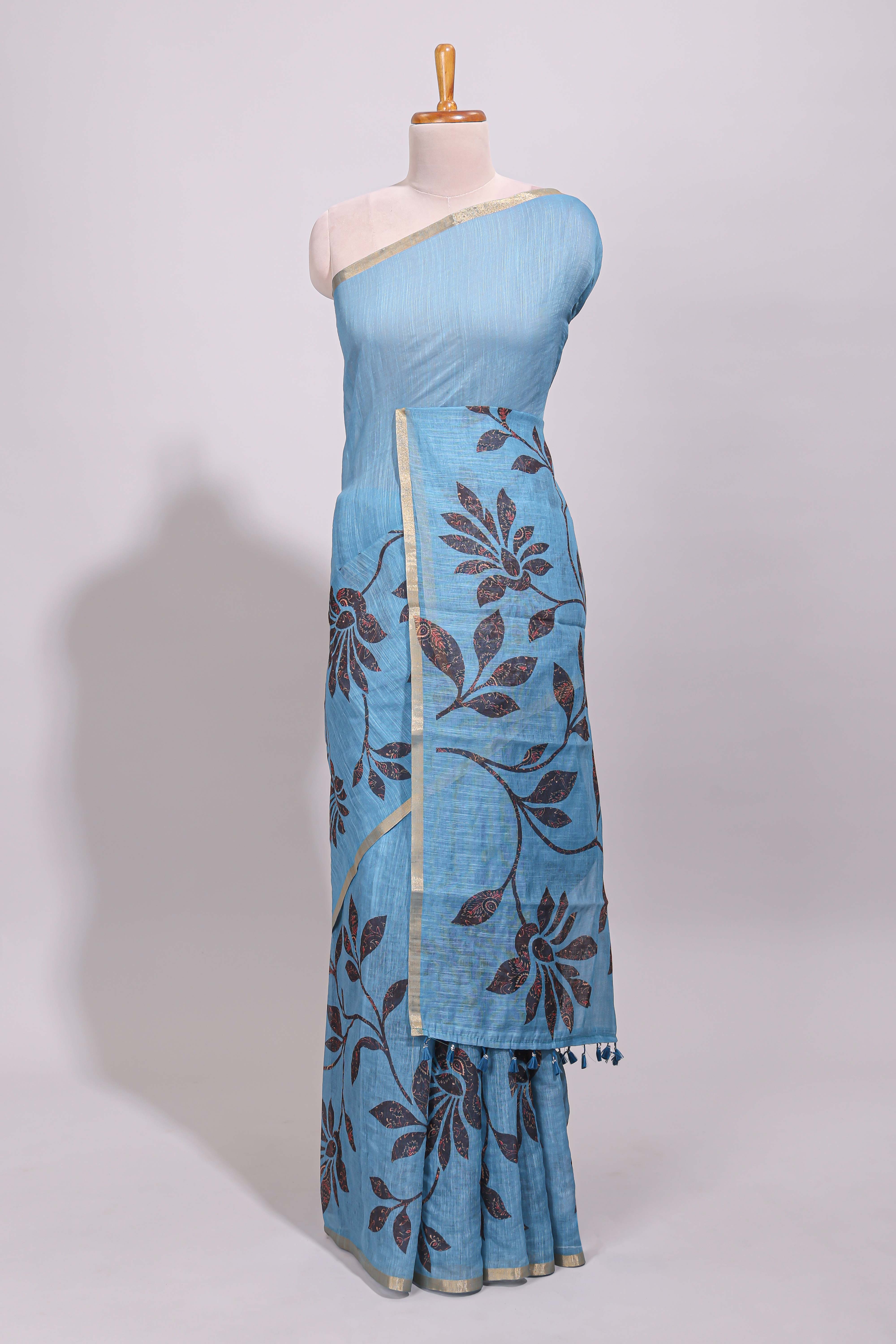 Blue floral design linen cotton saree with self zari border and contrast printed blouse