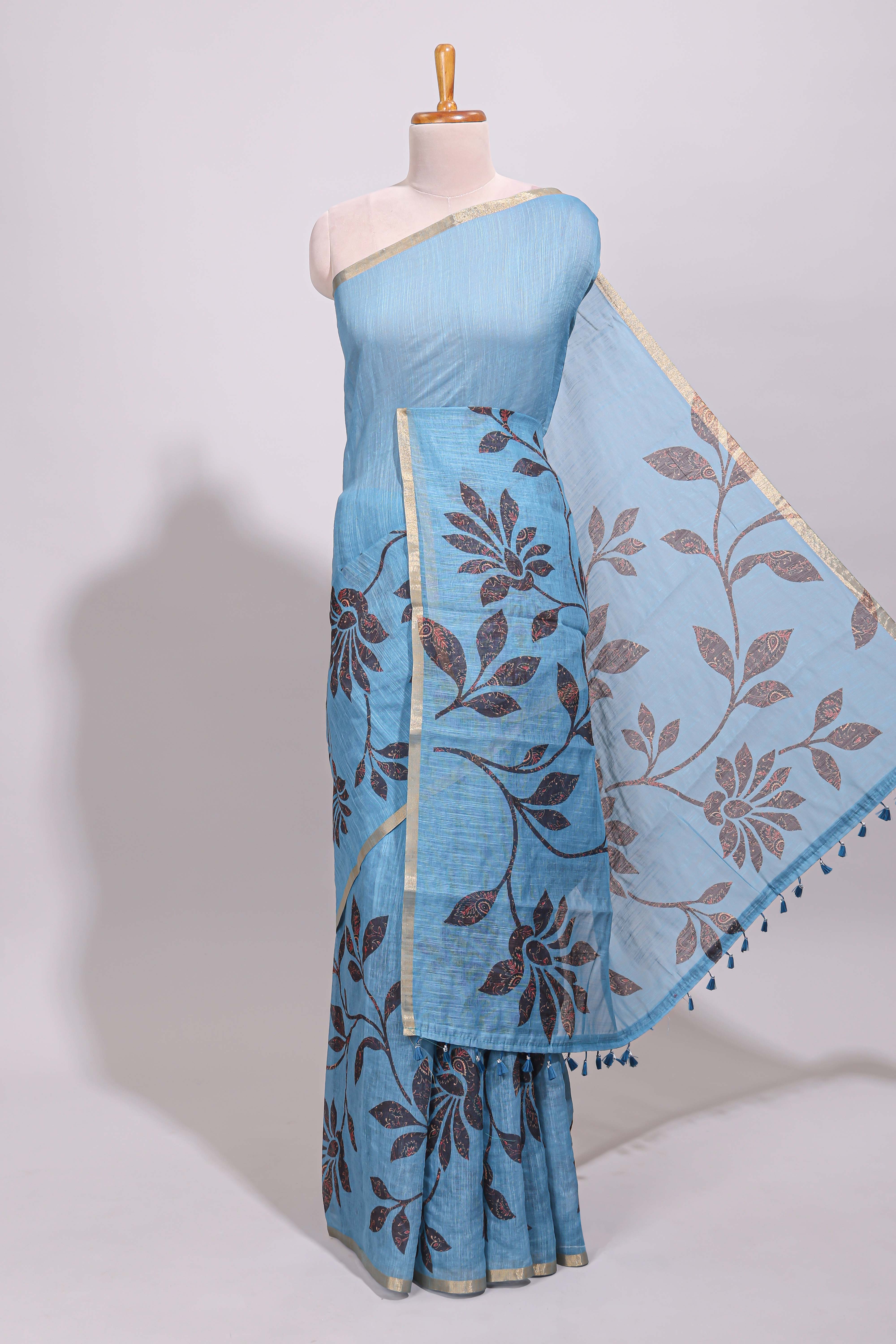 Blue floral design linen cotton saree with self zari border and contrast printed blouse