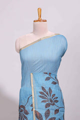 Blue floral design linen cotton saree with self zari border and contrast printed blouse