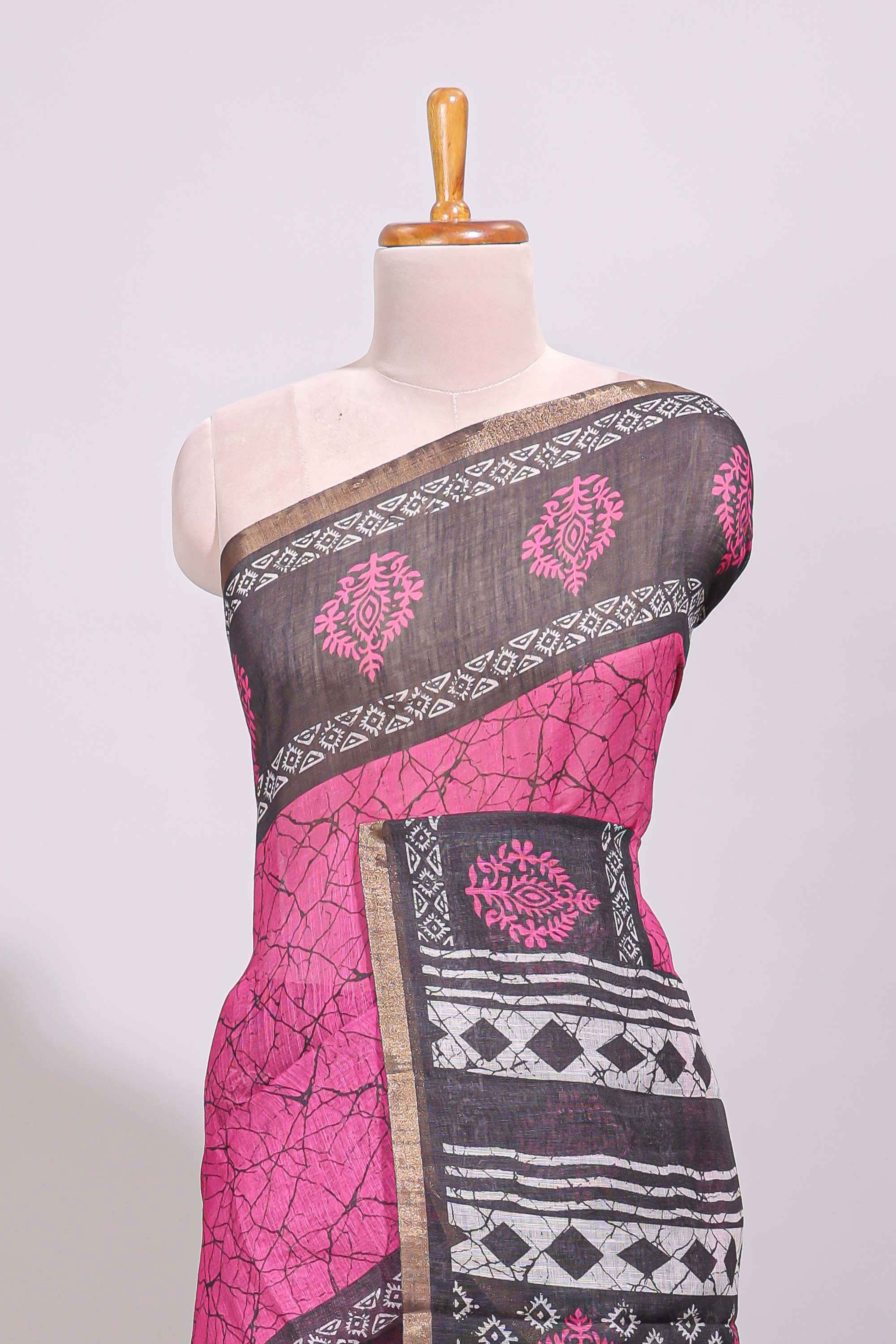 Pink crack design linen cotton saree with contrast zari border and printed blouse