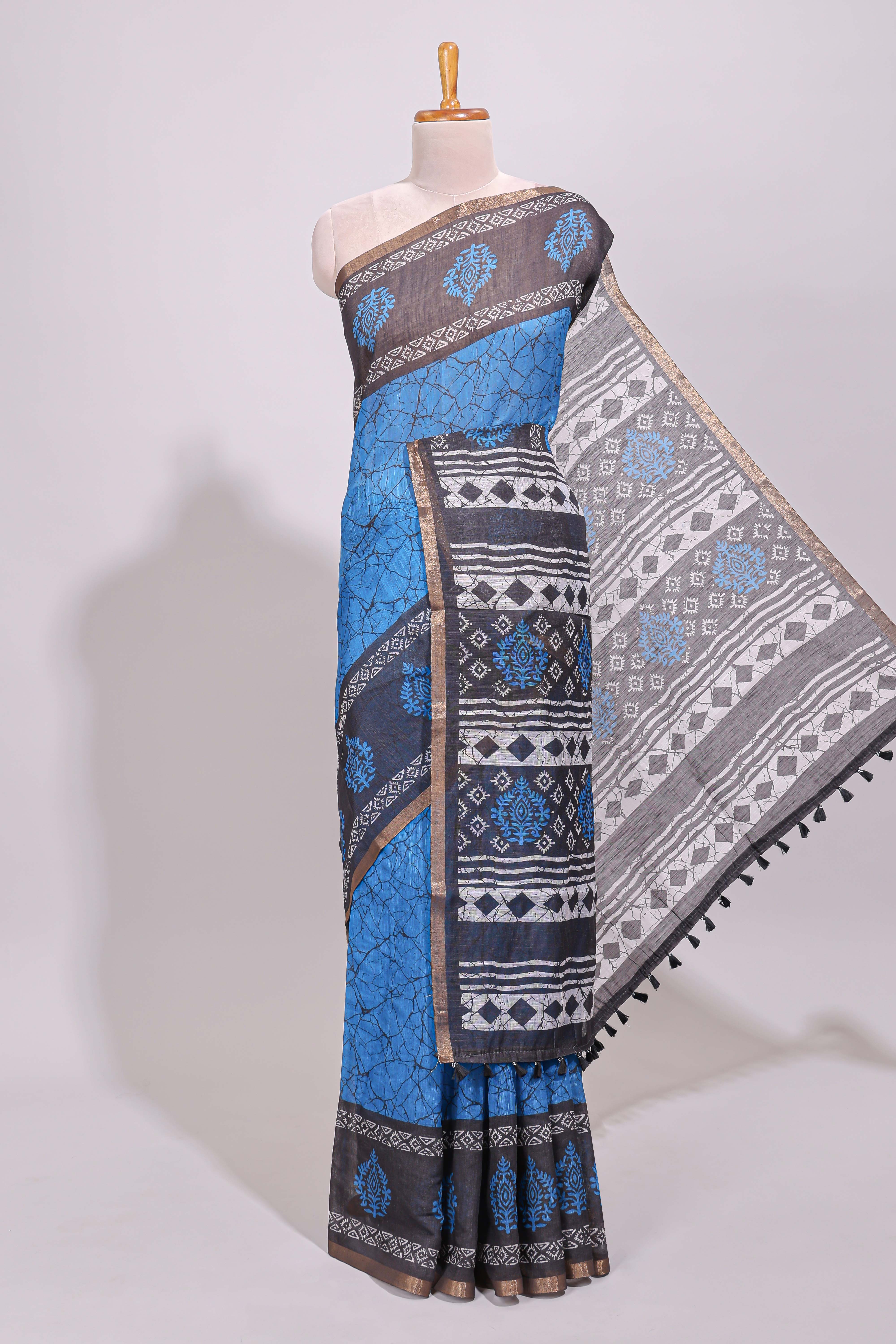 Blue crack design linen cotton saree with contrast zari border and printed blouse