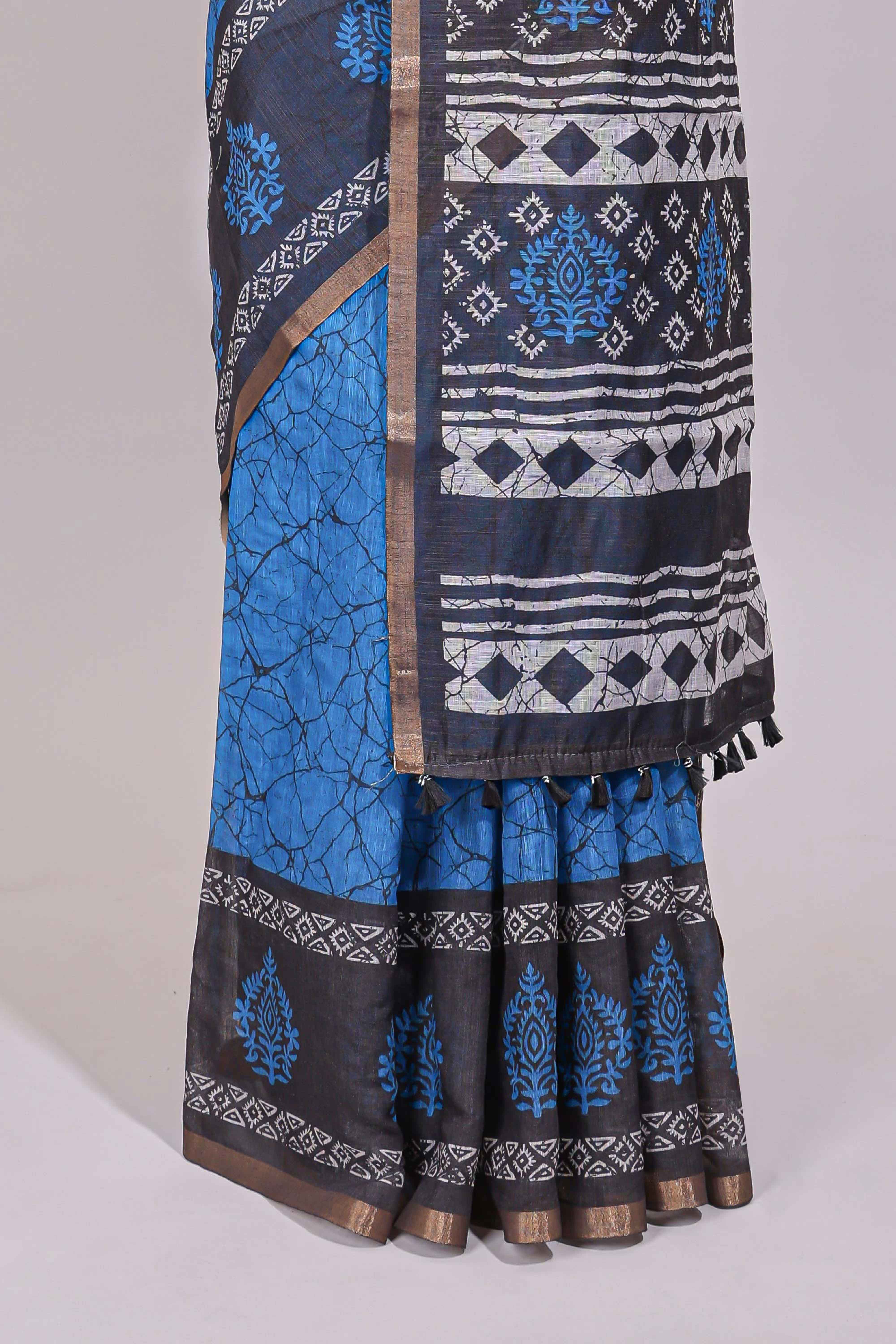 Blue crack design linen cotton saree with contrast zari border and printed blouse