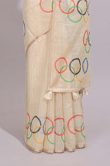 Cream olympic logo design linen cotton saree with self zari border and matching printed blouse