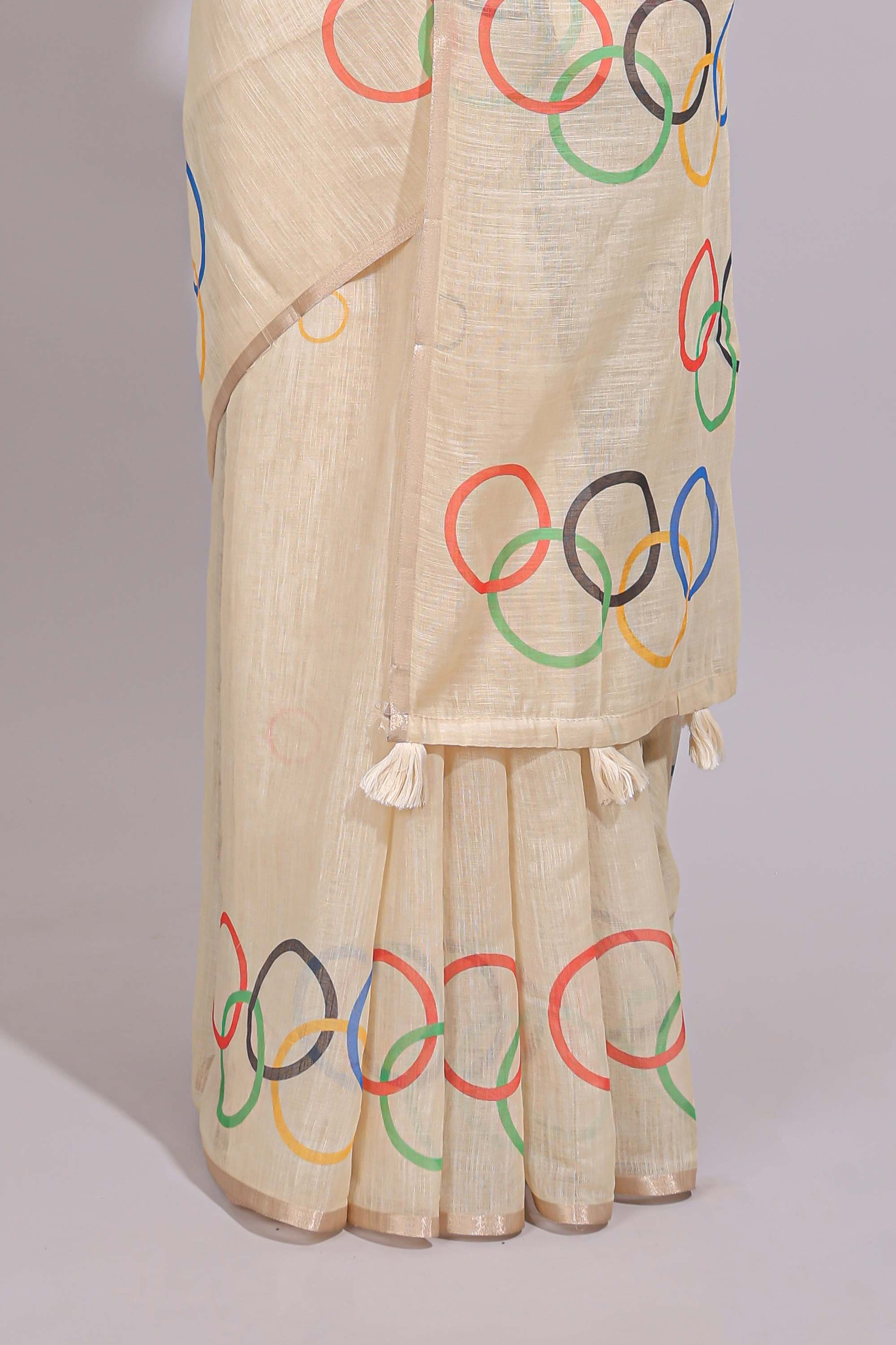 Cream olympic logo design linen cotton saree with self zari border and matching printed blouse