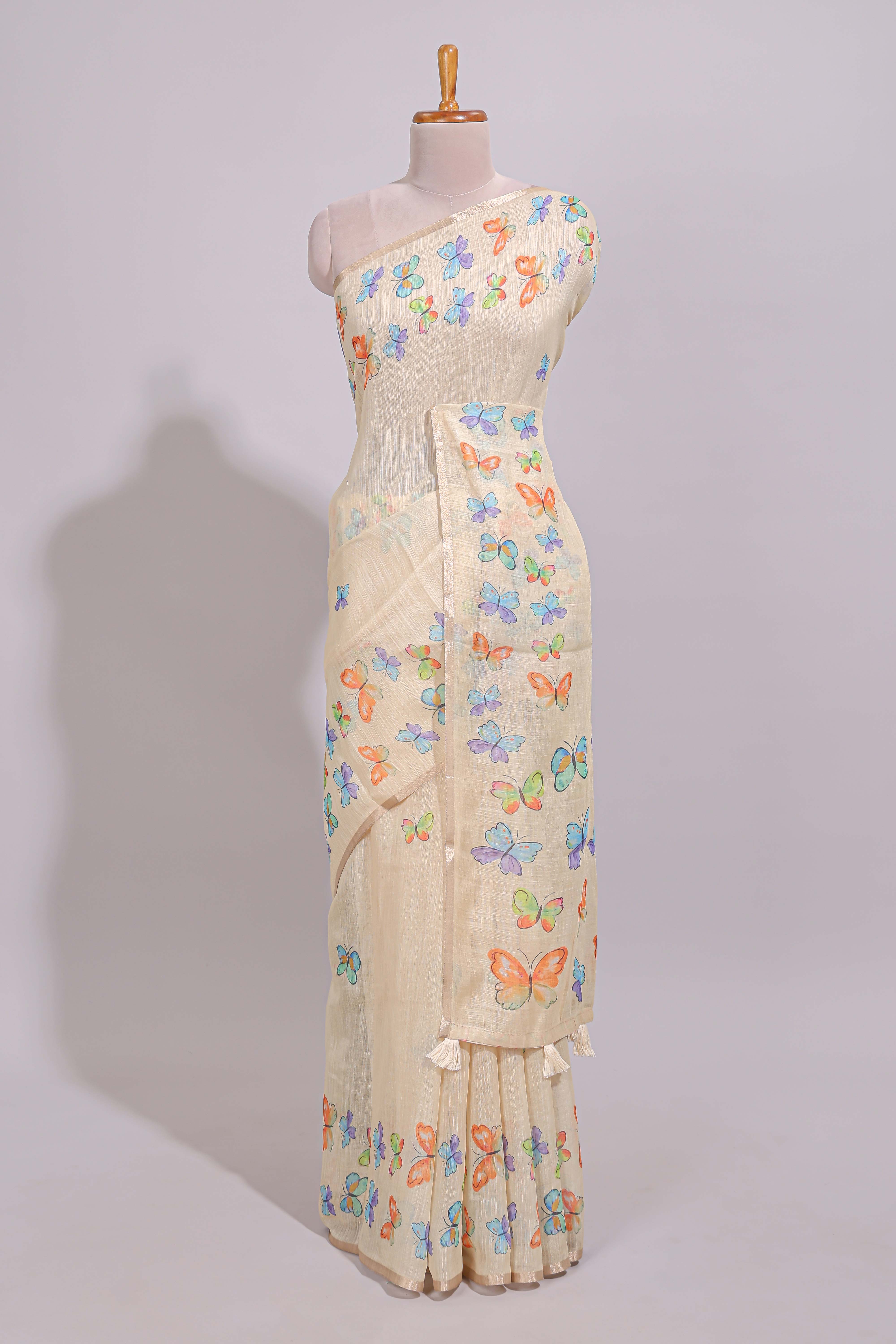 Cream butterfly motifs linen cotton saree with self zari border and matching printed blouse