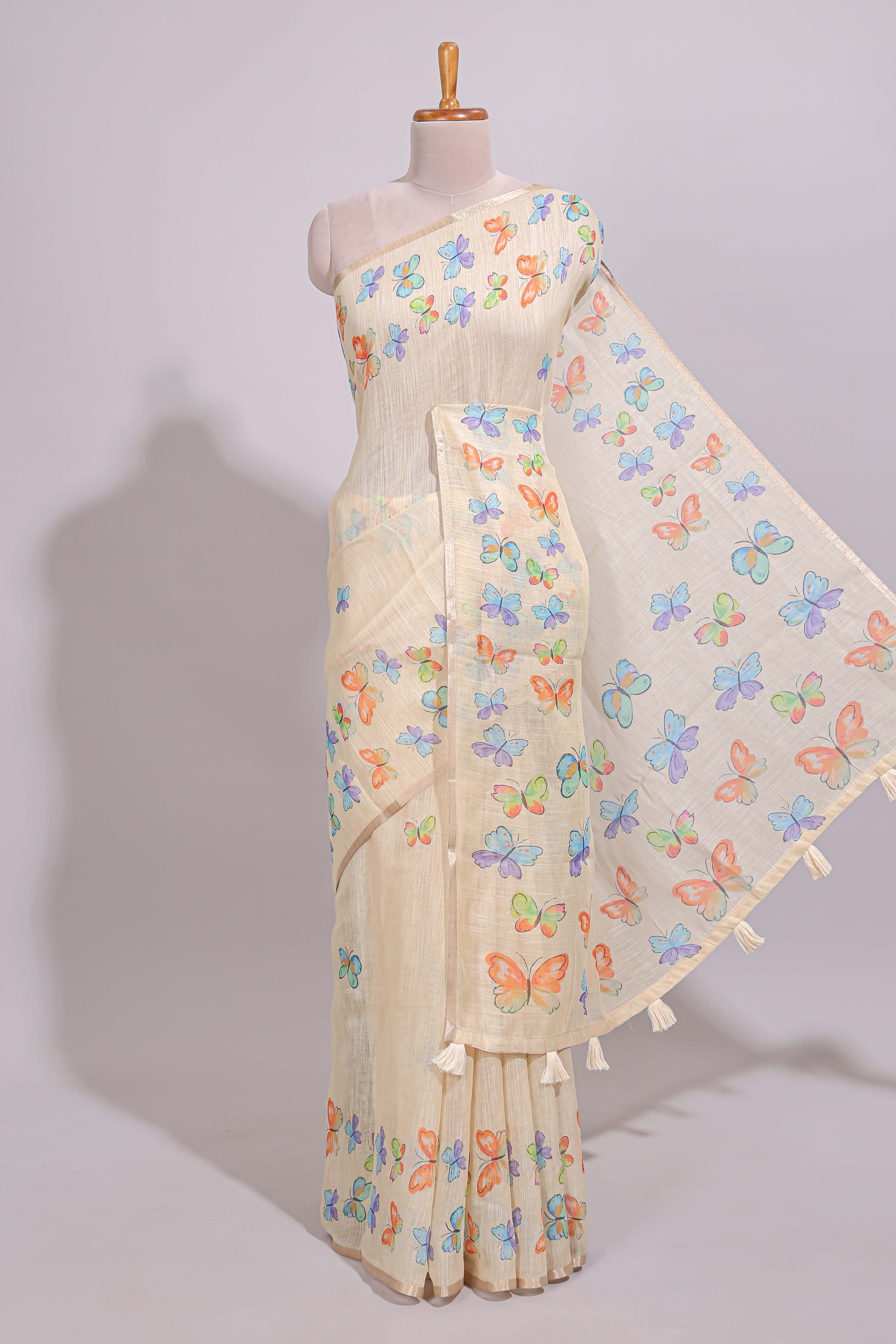 Cream butterfly motifs linen cotton saree with self zari border and matching printed blouse