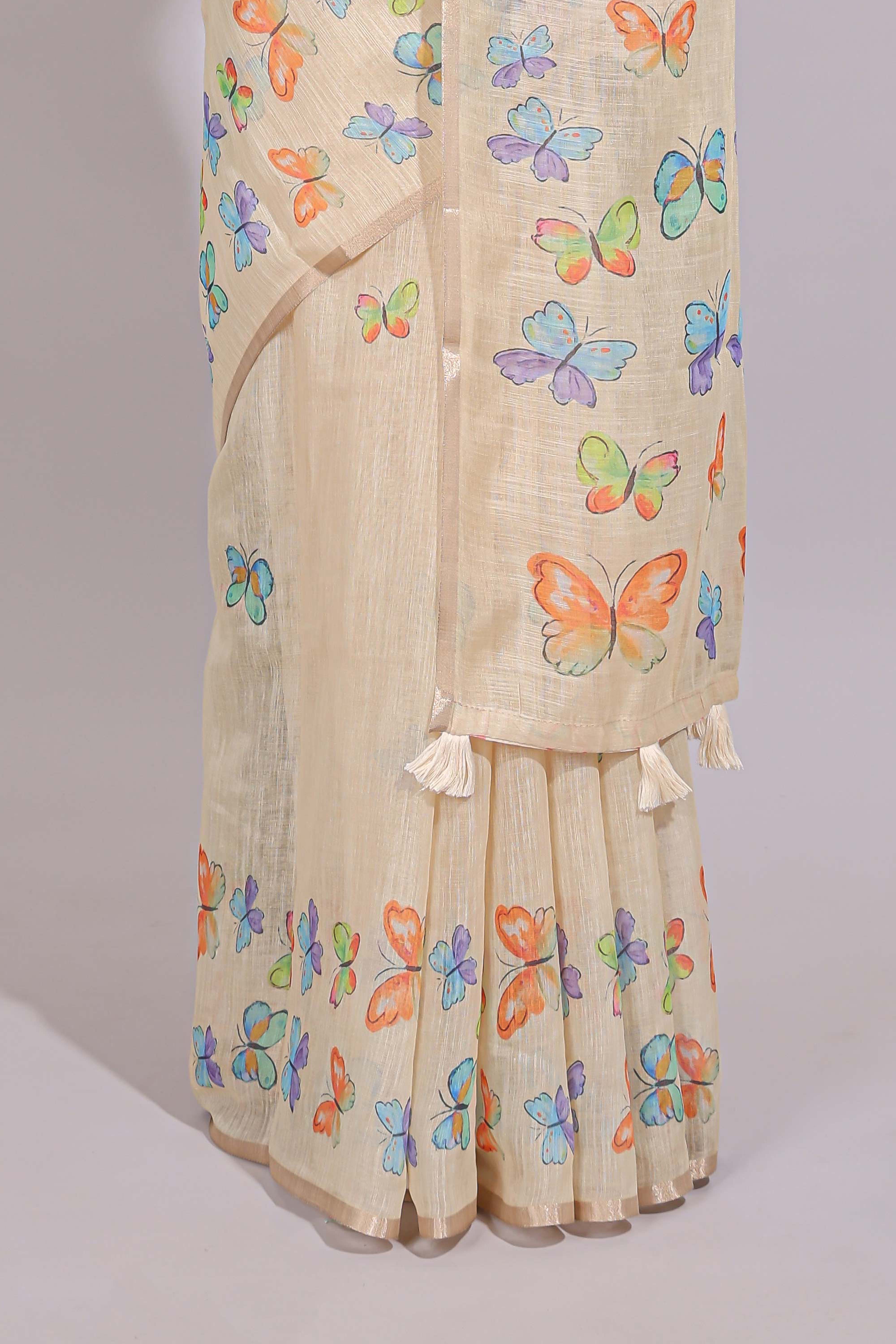 Cream butterfly motifs linen cotton saree with self zari border and matching printed blouse