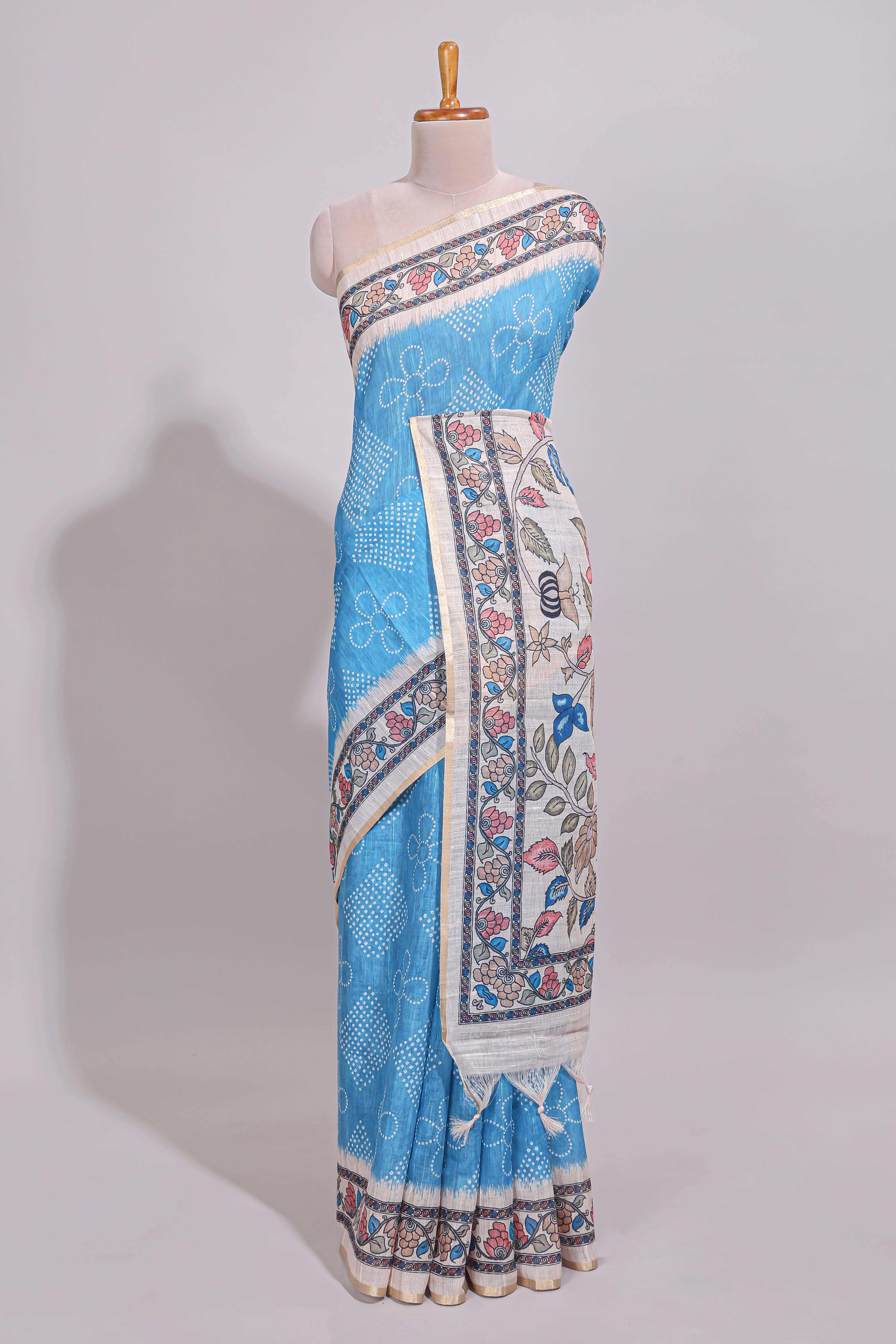 Blue floral print motifs linen cotton saree with contrast zari border and printed motifs blouse