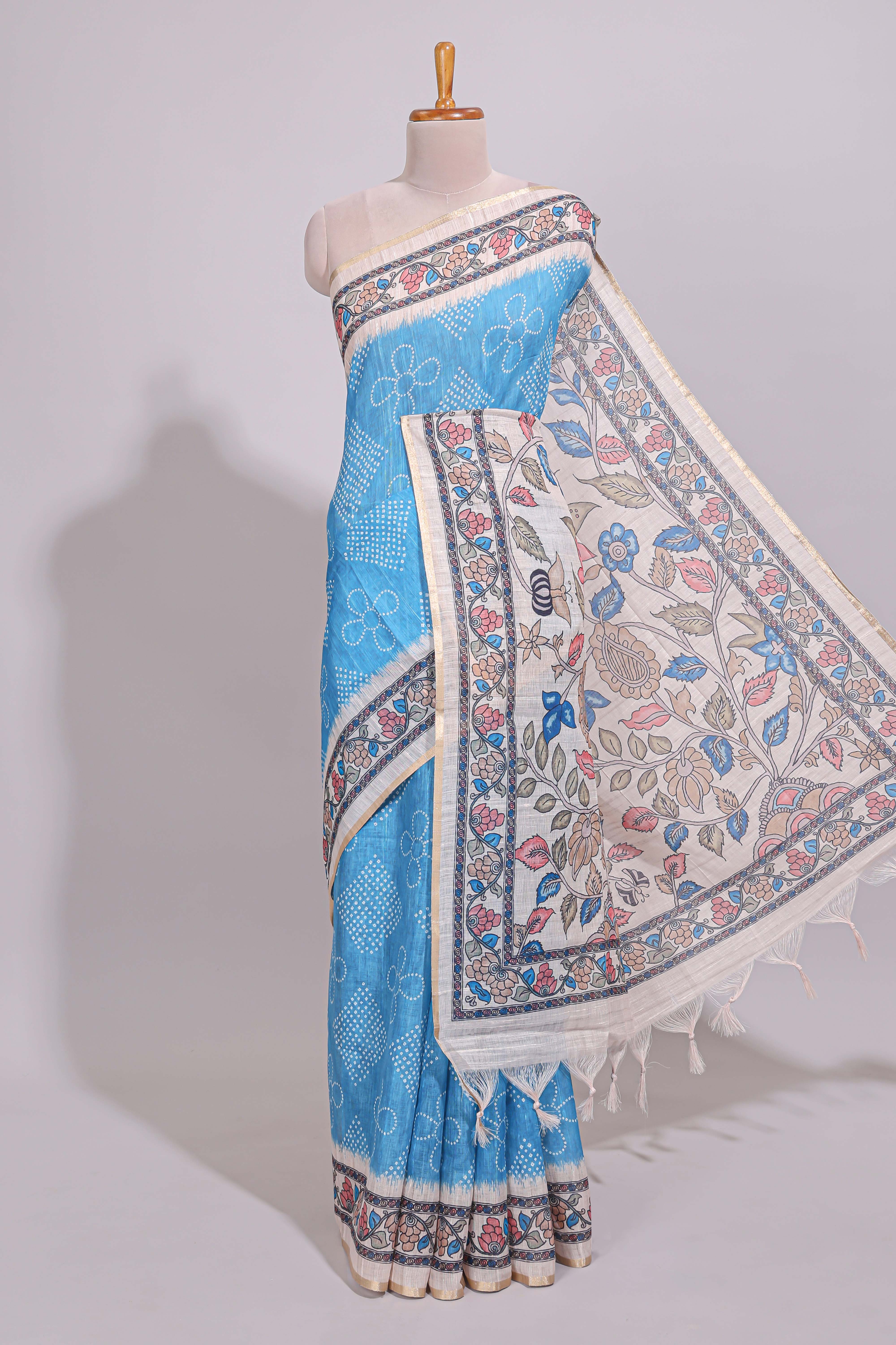 Blue floral print motifs linen cotton saree with contrast zari border and printed motifs blouse
