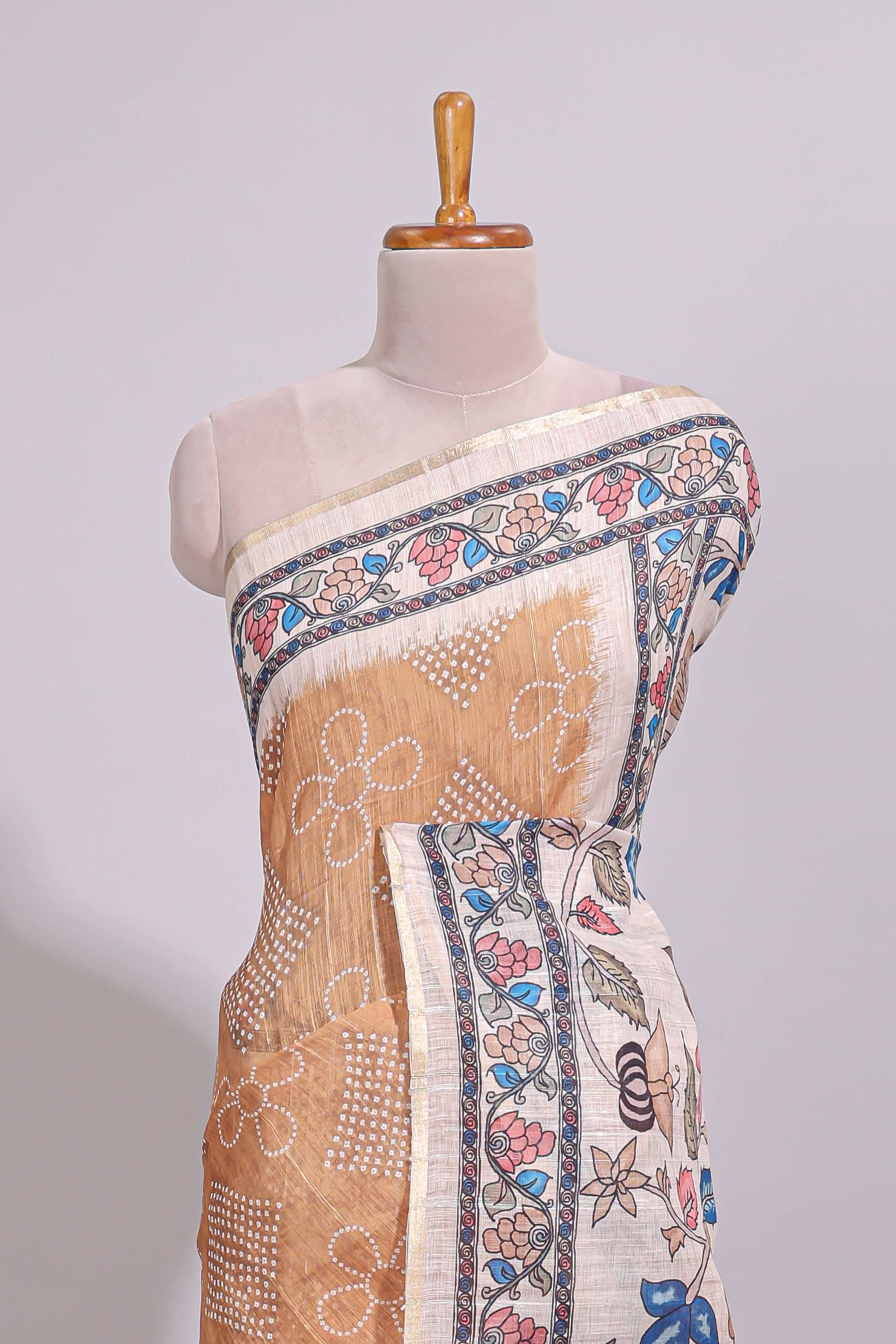 Orange floral print motifs linen cotton saree with contrast zari border and printed motifs blouse