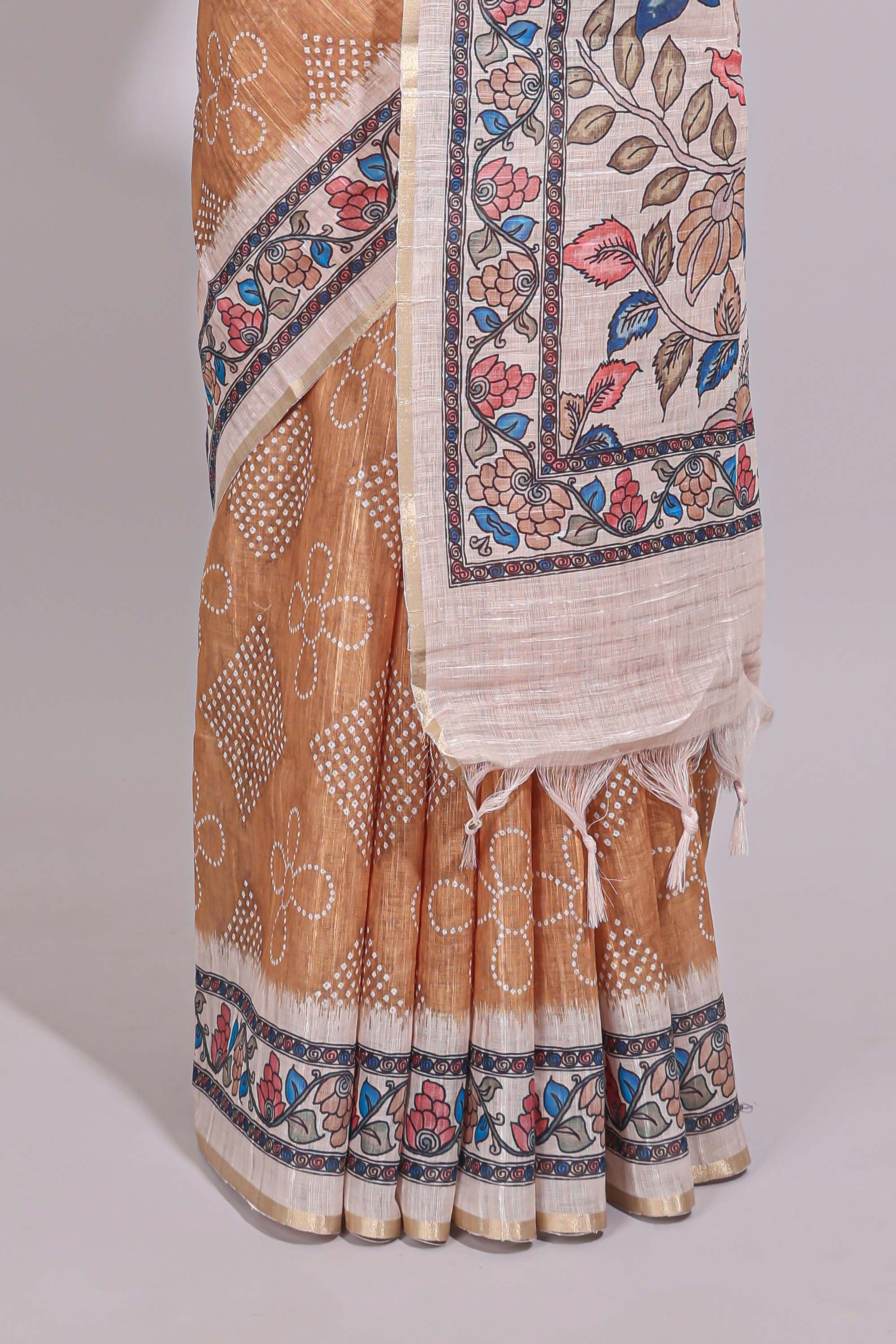 Orange floral print motifs linen cotton saree with contrast zari border and printed motifs blouse