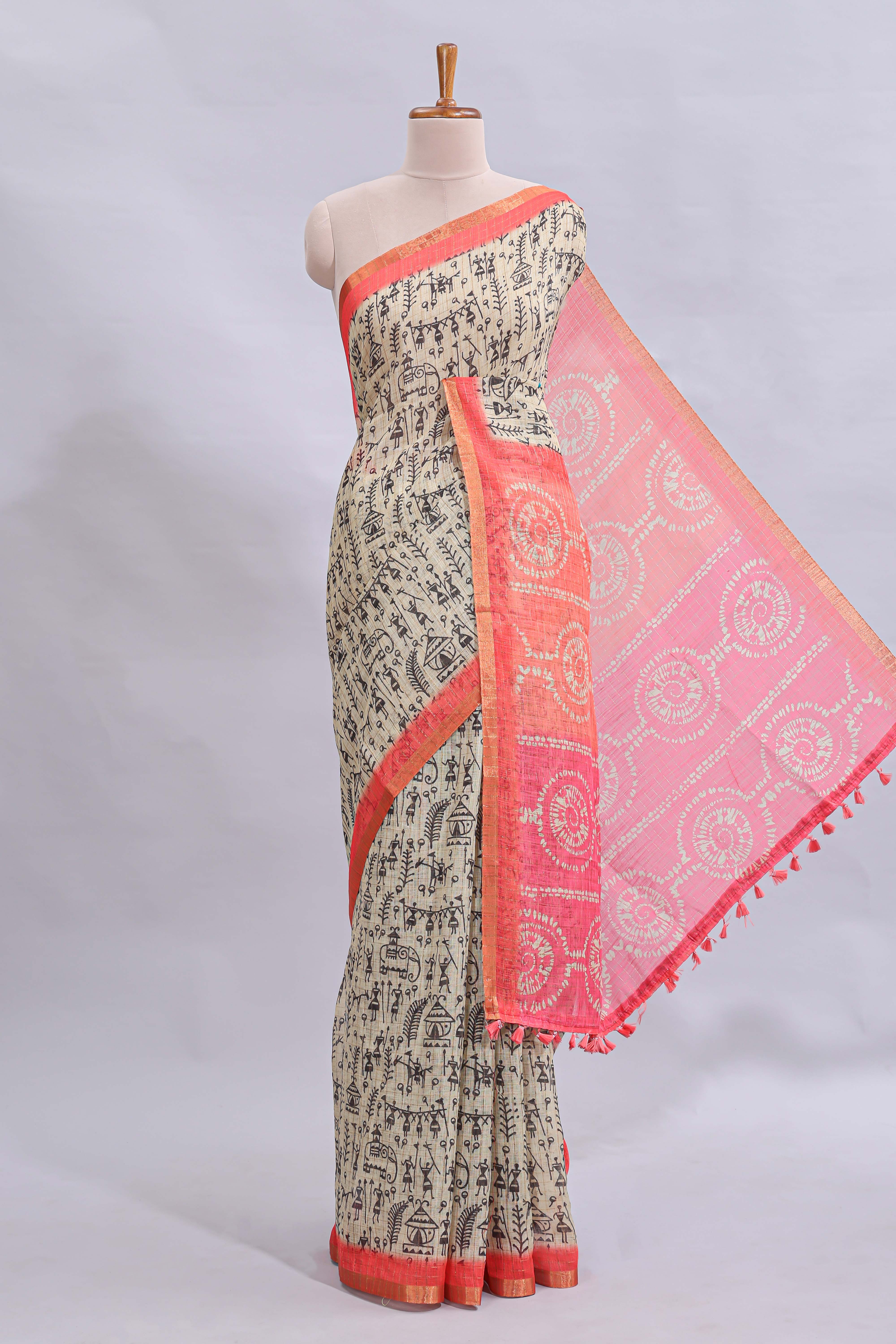 Beige tribal design warli print linen cotton saree with contrast pink zari border and chevron design blouse