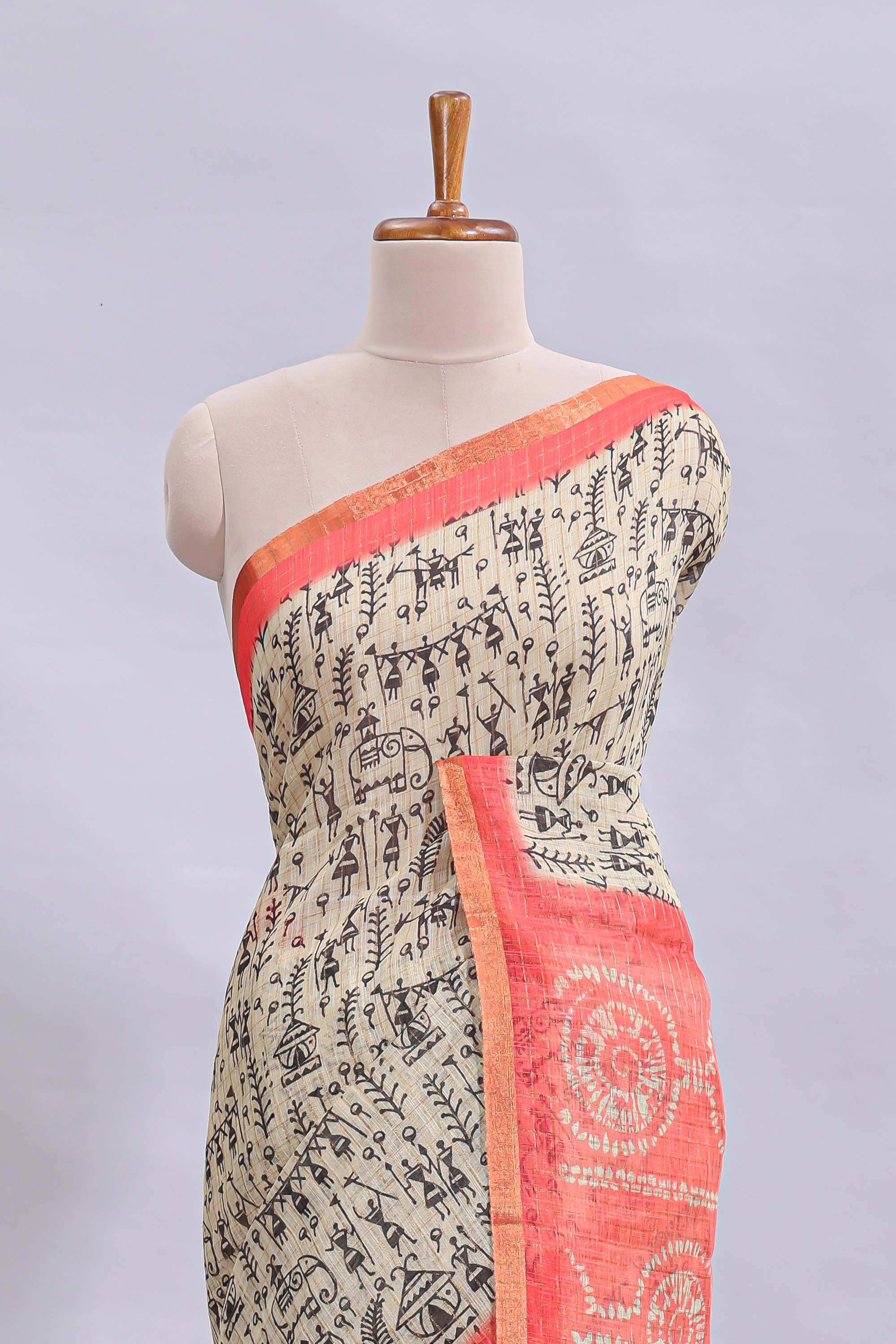 Beige tribal design warli print linen cotton saree with contrast pink zari border and chevron design blouse