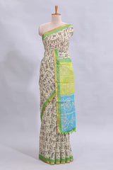 Beige tribal design warli print linen cotton saree with contrast green zari border and chevron design blouse