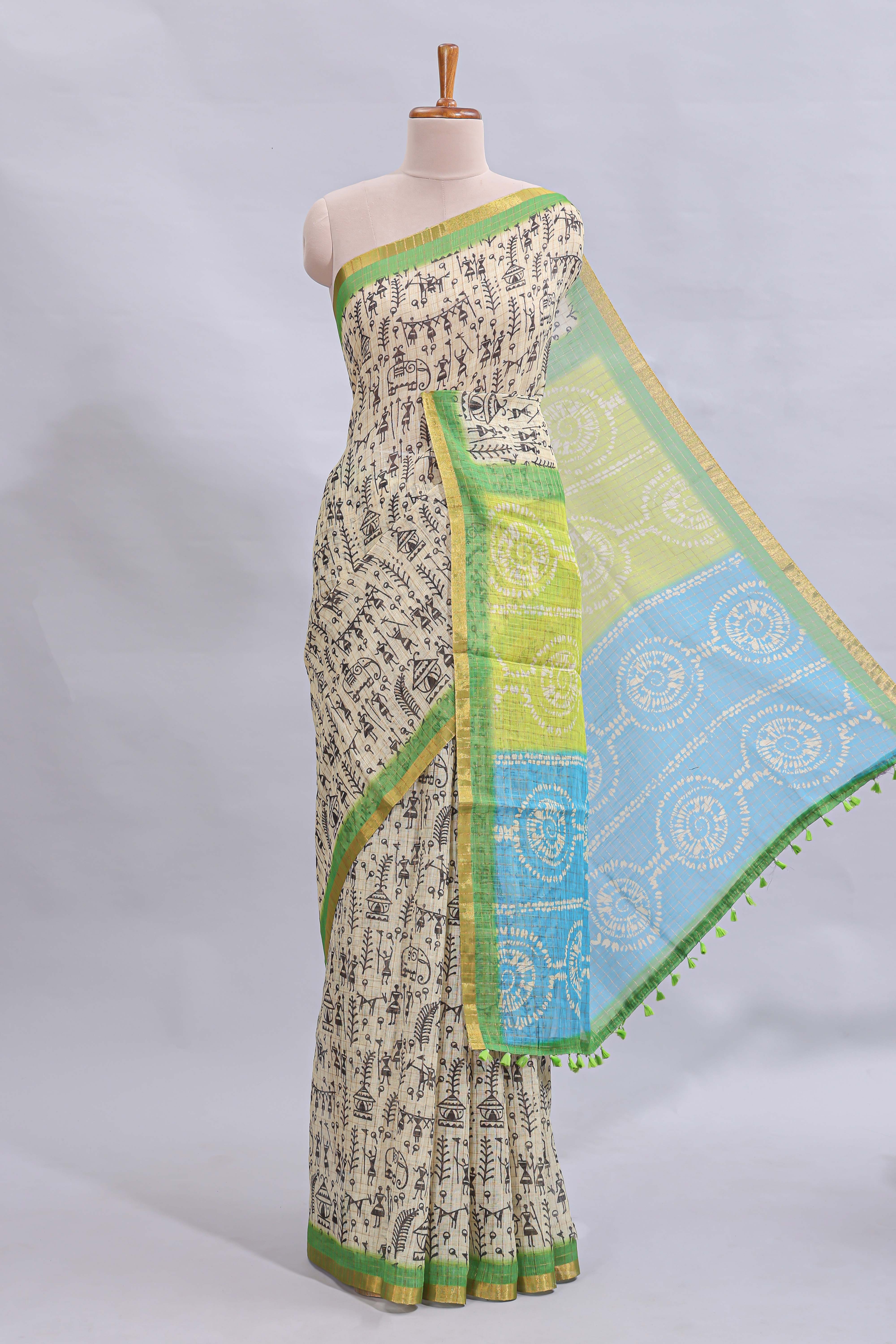 Beige tribal design warli print linen cotton saree with contrast green zari border and chevron design blouse