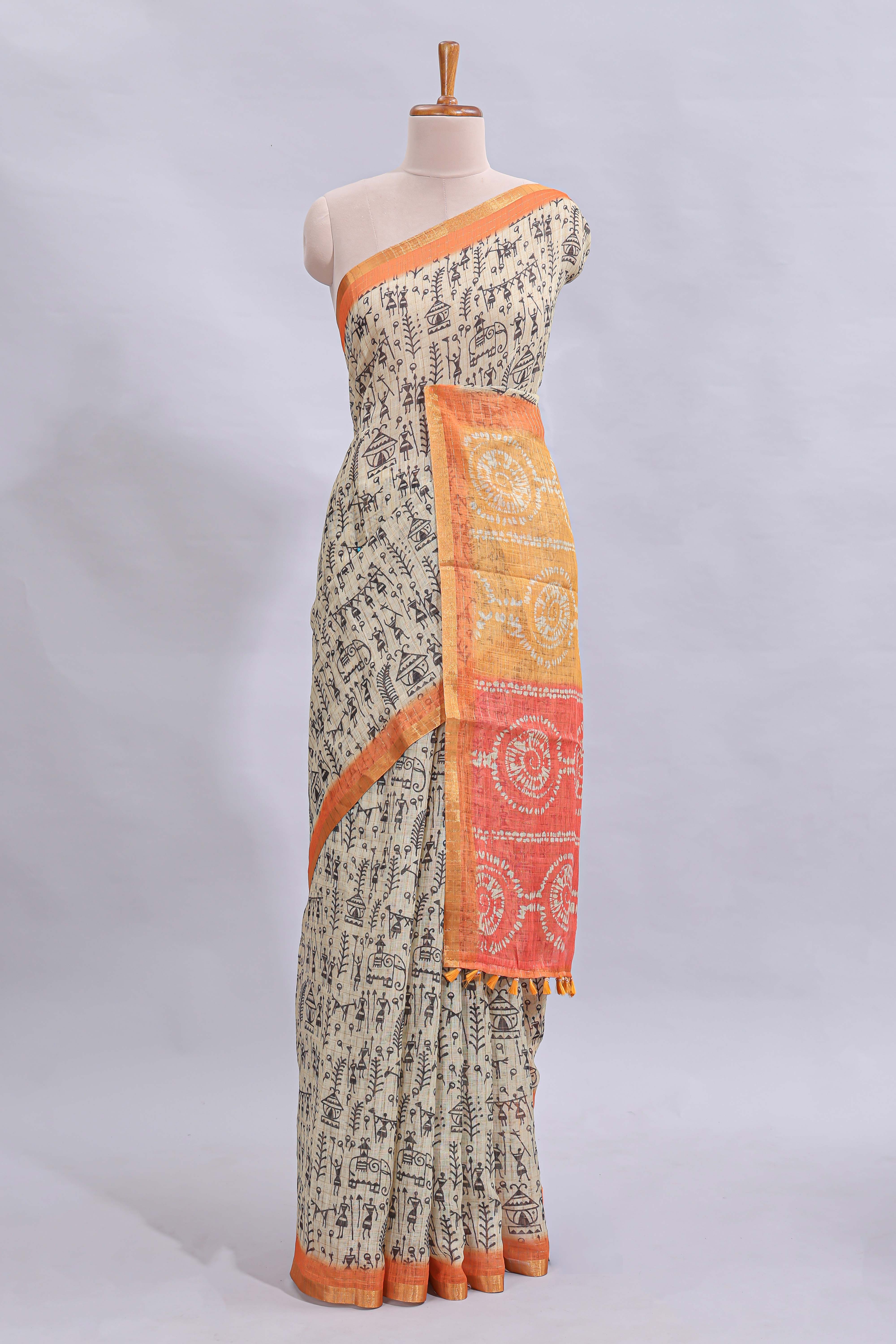 Beige tribal design warli print linen cotton saree with contrast orange zari border and warli design blouse