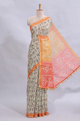 Beige tribal design warli print linen cotton saree with contrast orange zari border and warli design blouse