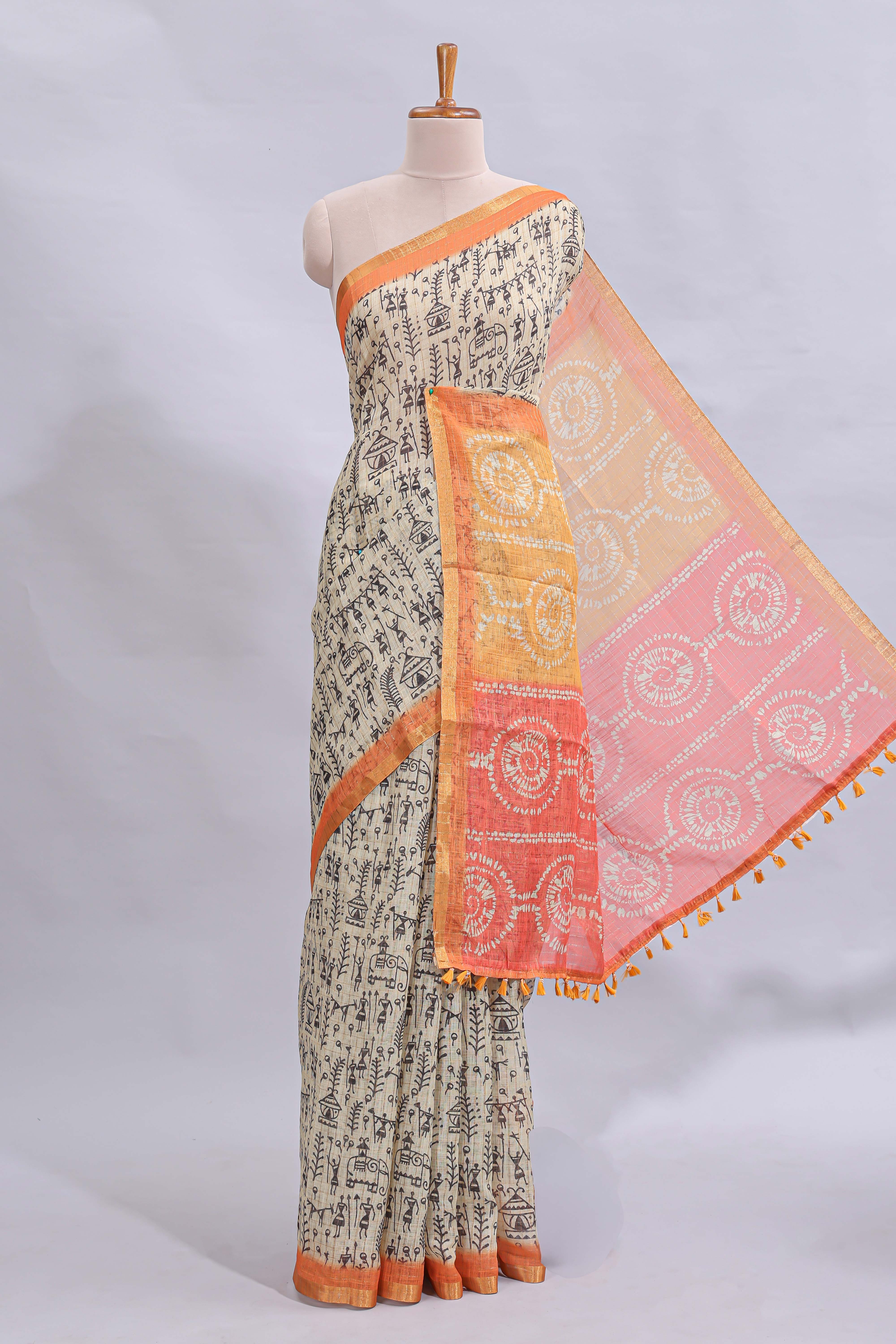 Beige tribal design warli print linen cotton saree with contrast orange zari border and warli design blouse