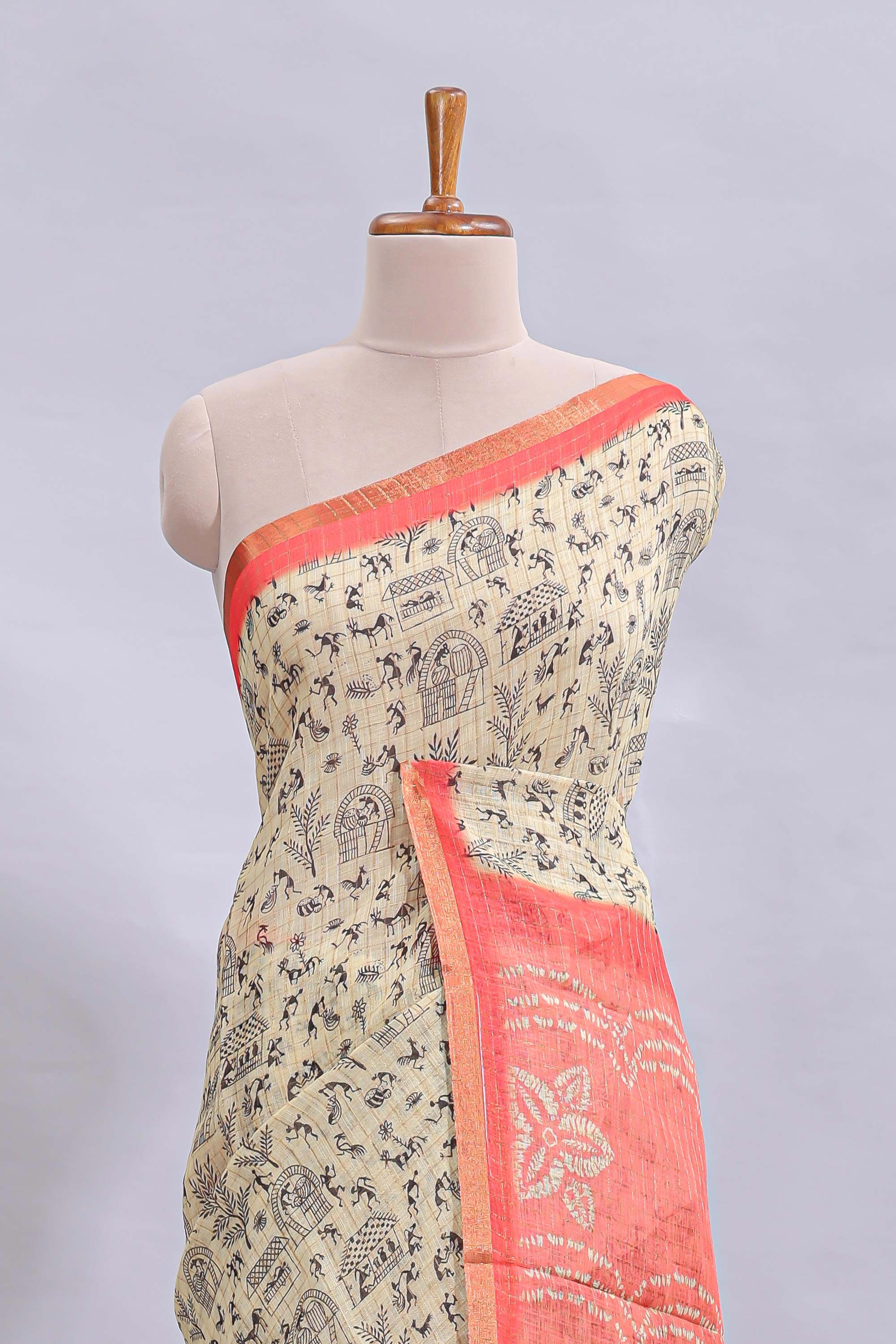 Beige tribal design warli print linen cotton saree with contrast pink zari border and floral design pallu
