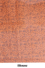 Beige tribal design warli print linen cotton saree with contrast orange zari border and floral design pallu