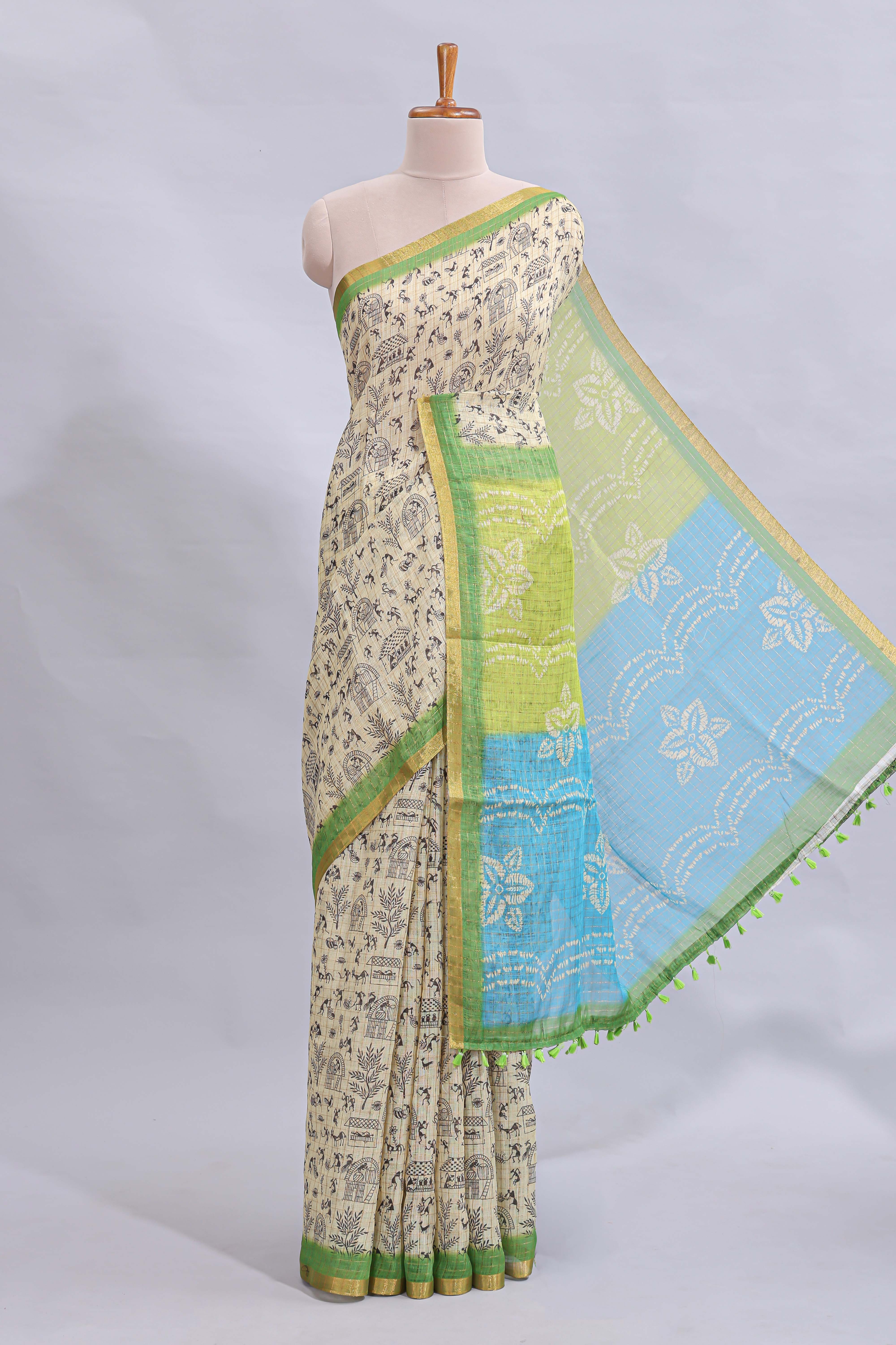 Beige tribal design warli print linen cotton saree with contrast green zari border and floral design pallu