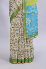 Beige tribal design warli print linen cotton saree with contrast green zari border and floral design pallu