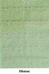 Beige tribal design warli print linen cotton saree with contrast green zari border and floral design pallu