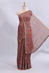 Maroon floral vines design linen cotton saree with self zari border and matching motifs blouse