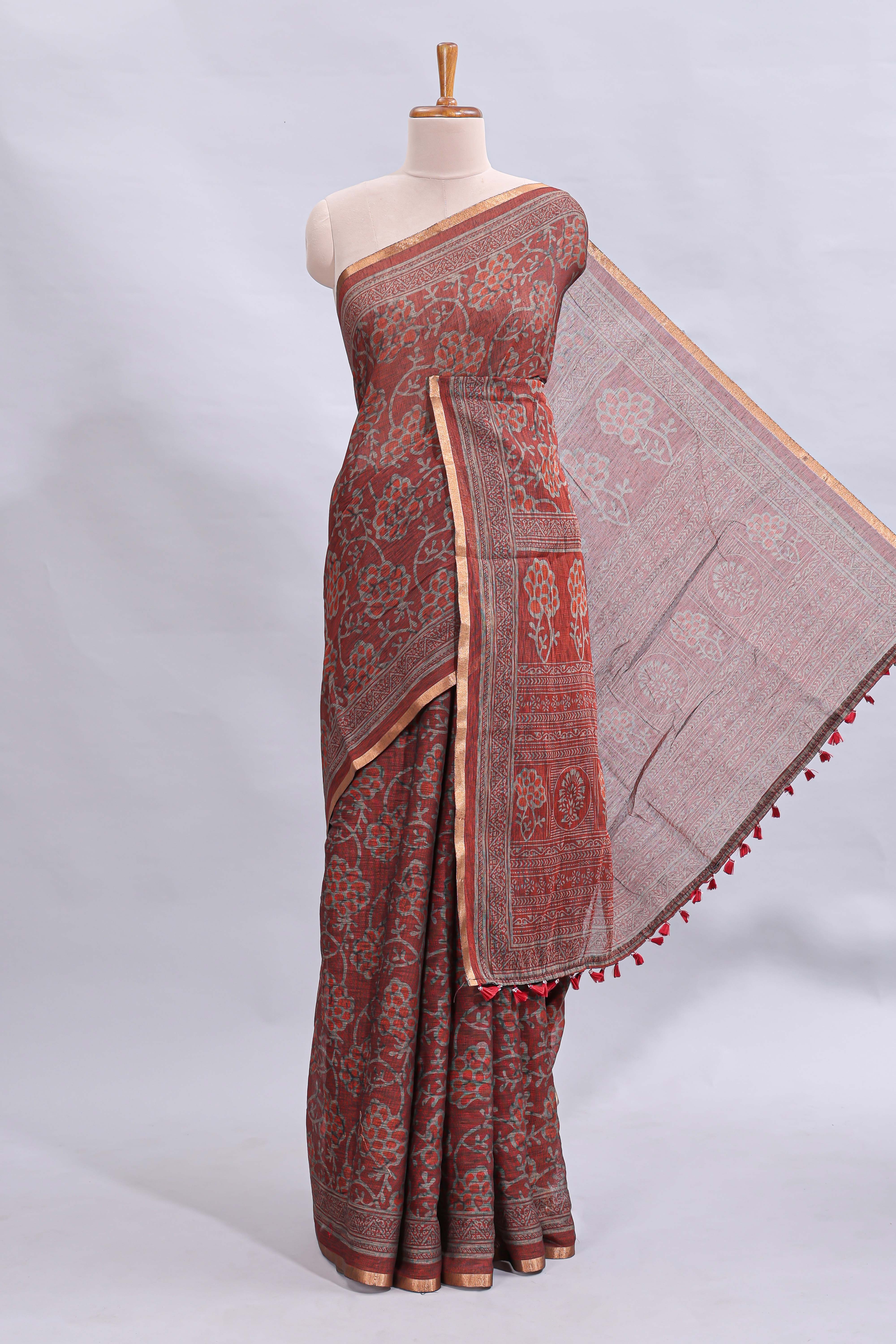 Maroon floral vines design linen cotton saree with self zari border and matching motifs blouse