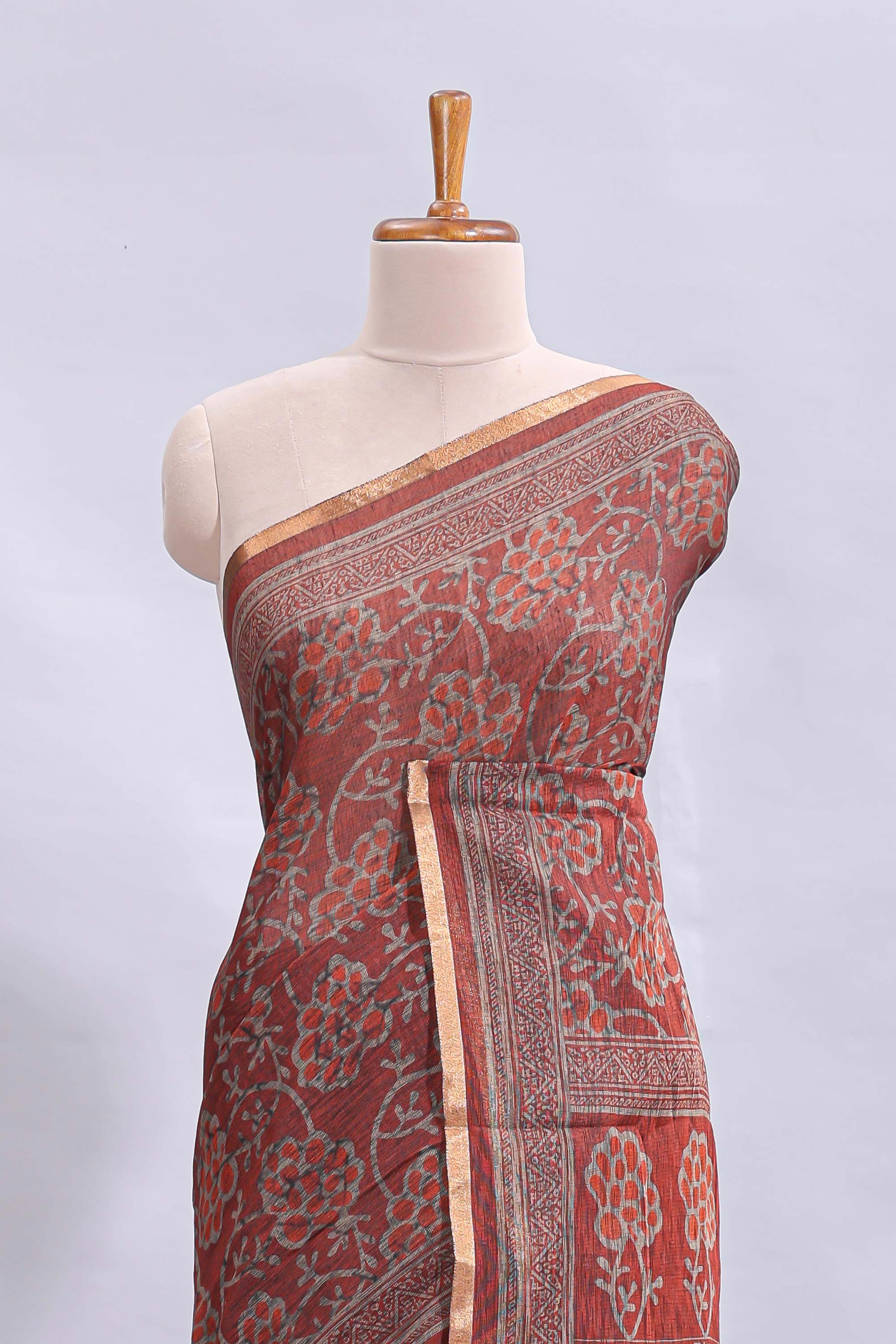 Maroon floral vines design linen cotton saree with self zari border and matching motifs blouse