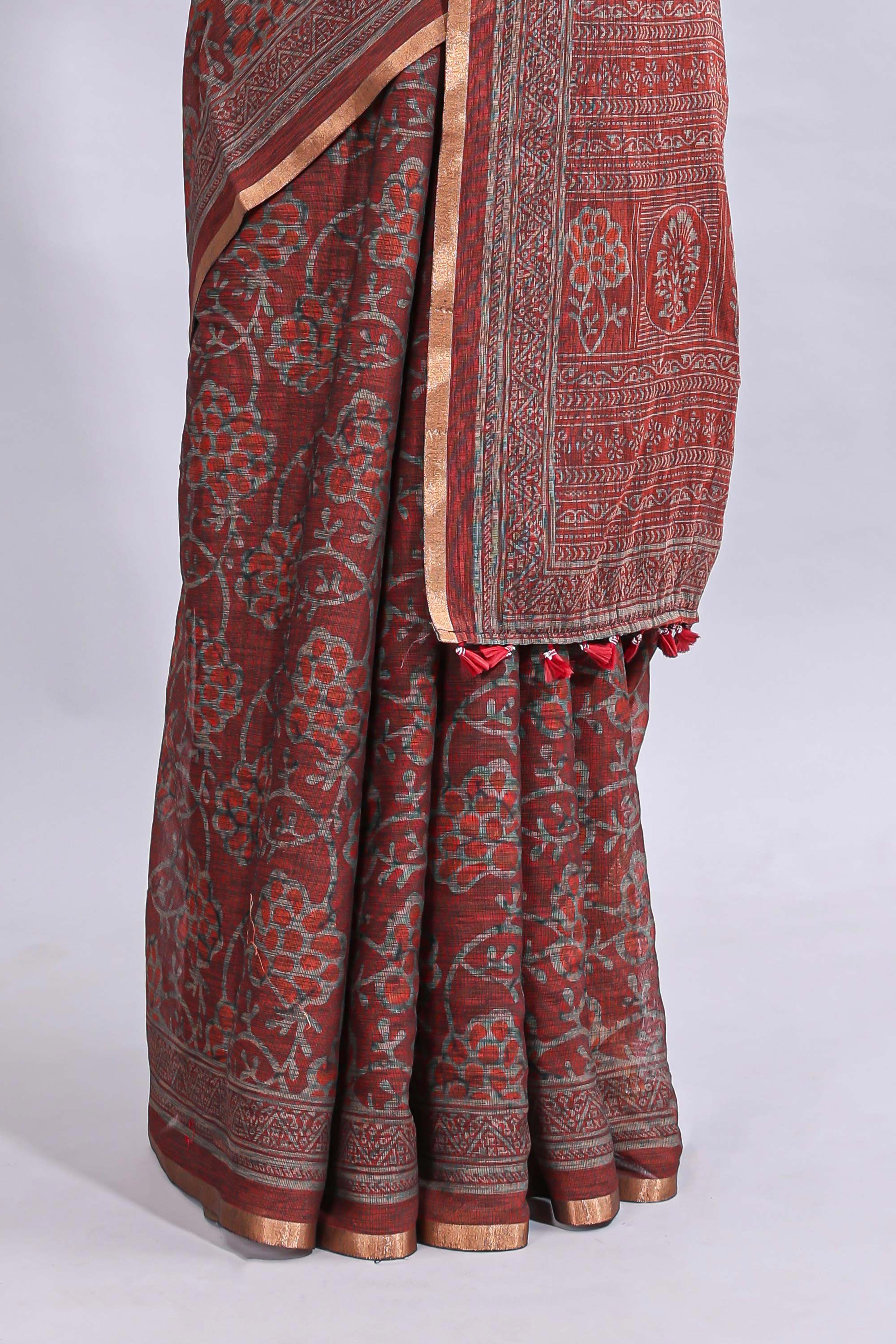 Maroon floral vines design linen cotton saree with self zari border and matching motifs blouse