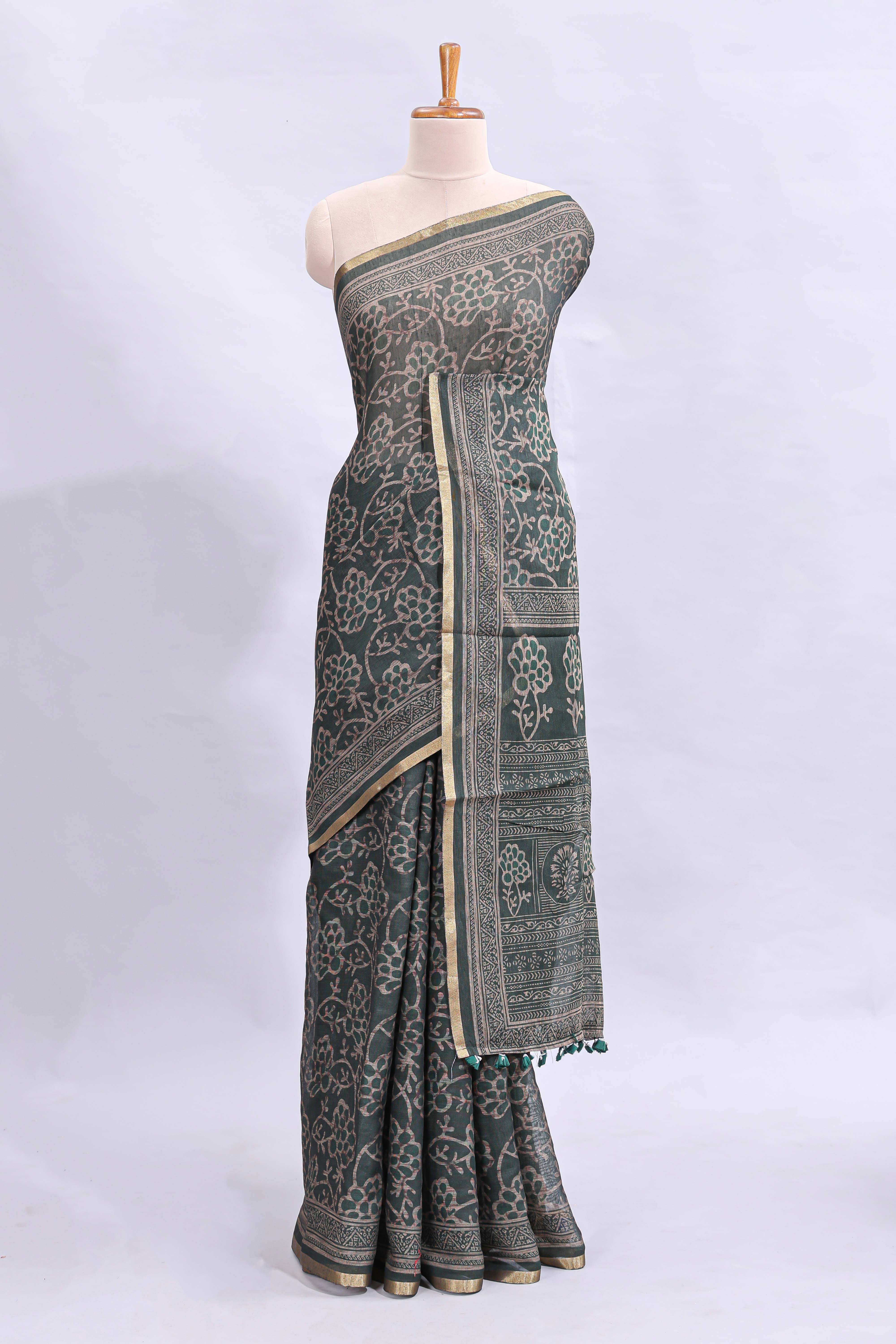 Bottle green floral vines design linen cotton saree with self zari border and matching motifs blouse