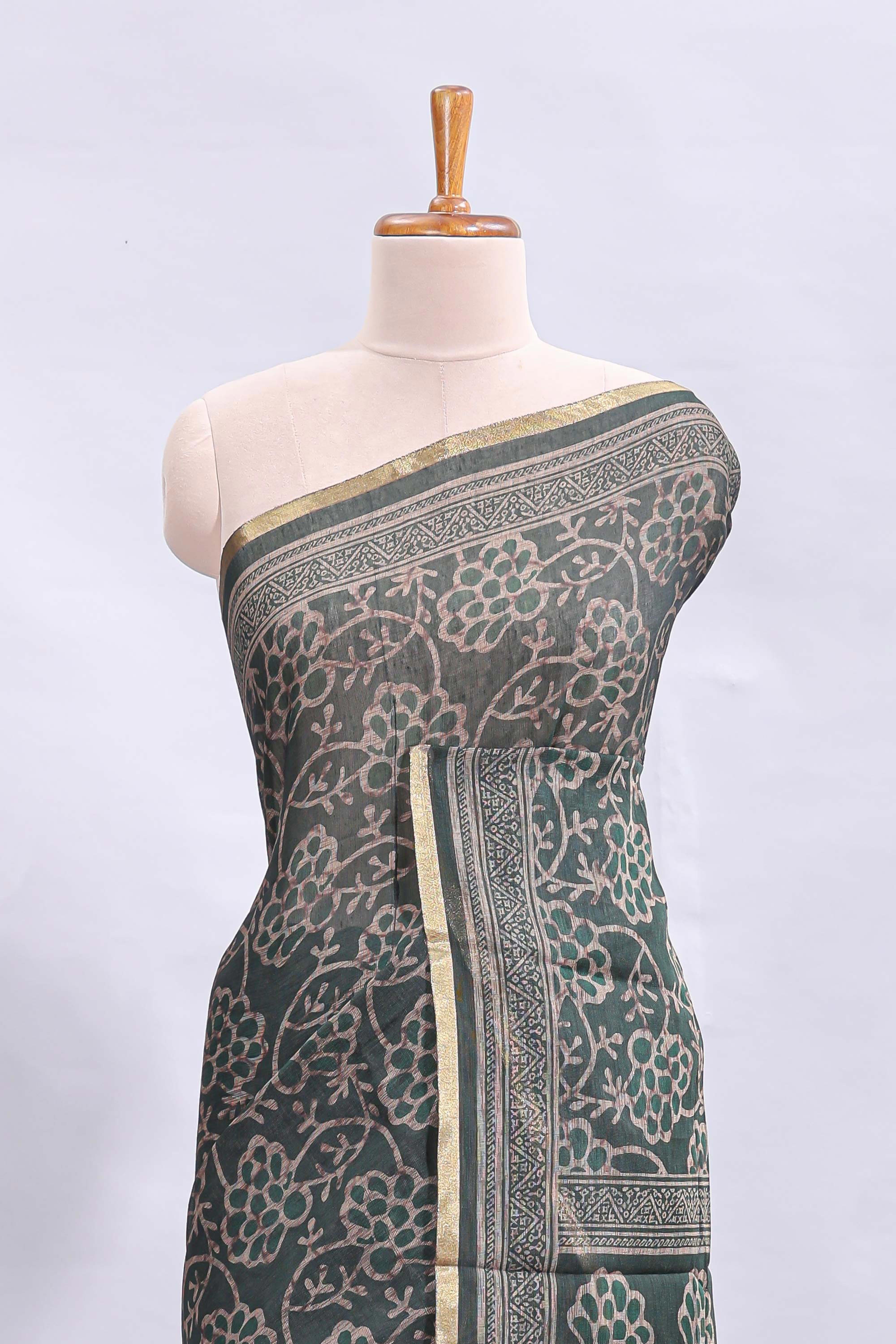 Bottle green floral vines design linen cotton saree with self zari border and matching motifs blouse