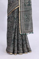 Bottle green floral vines design linen cotton saree with self zari border and matching motifs blouse