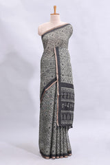 Grey warli tribe design linen cotton saree with contrast zari border and printed blouse