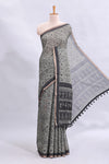 Grey warli tribe design linen cotton saree with contrast zari border and printed blouse