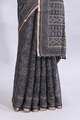 Black floral design linen cotton saree with self zari border and matching printed blouse