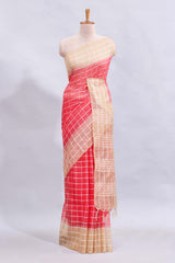Pink checked linen cotton saree with contrast border and striped blouse