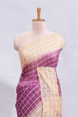 Magenta checked linen cotton saree with contrast border and striped blouse