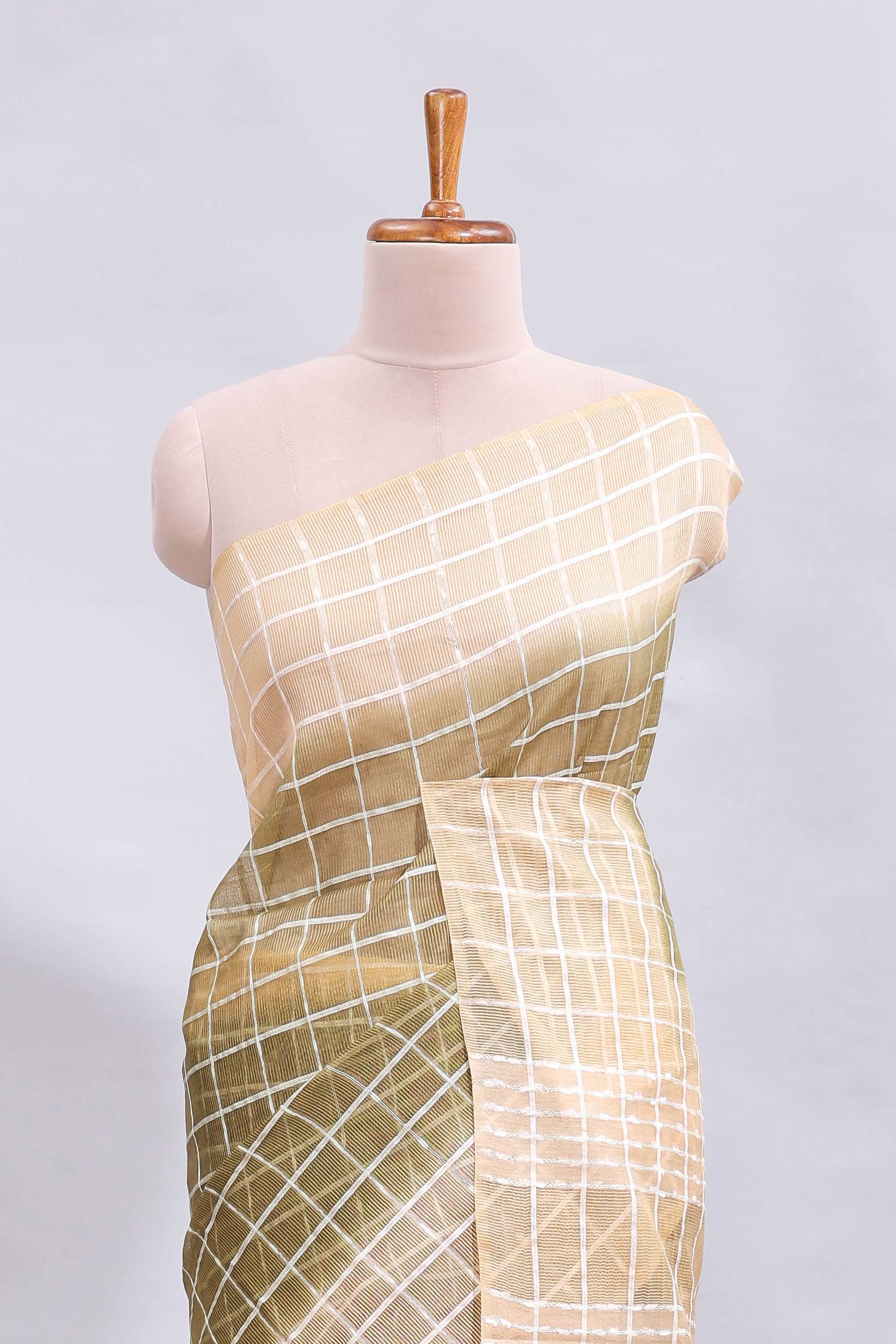 Green checked linen cotton saree with contrast border and striped blouse