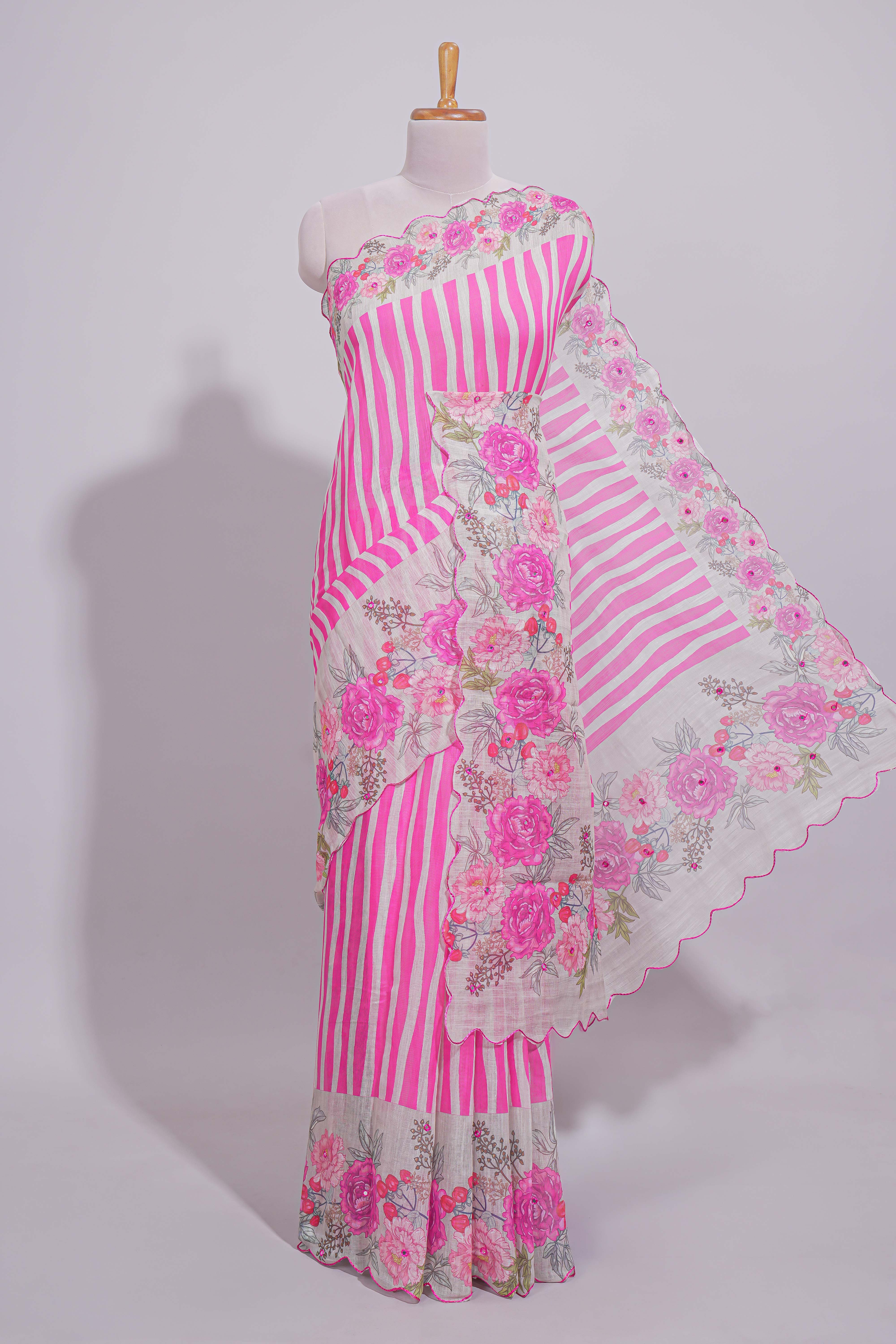 White Linen saree with pink stripes and vibrant pink floral scallop border with contrast printed blouse
