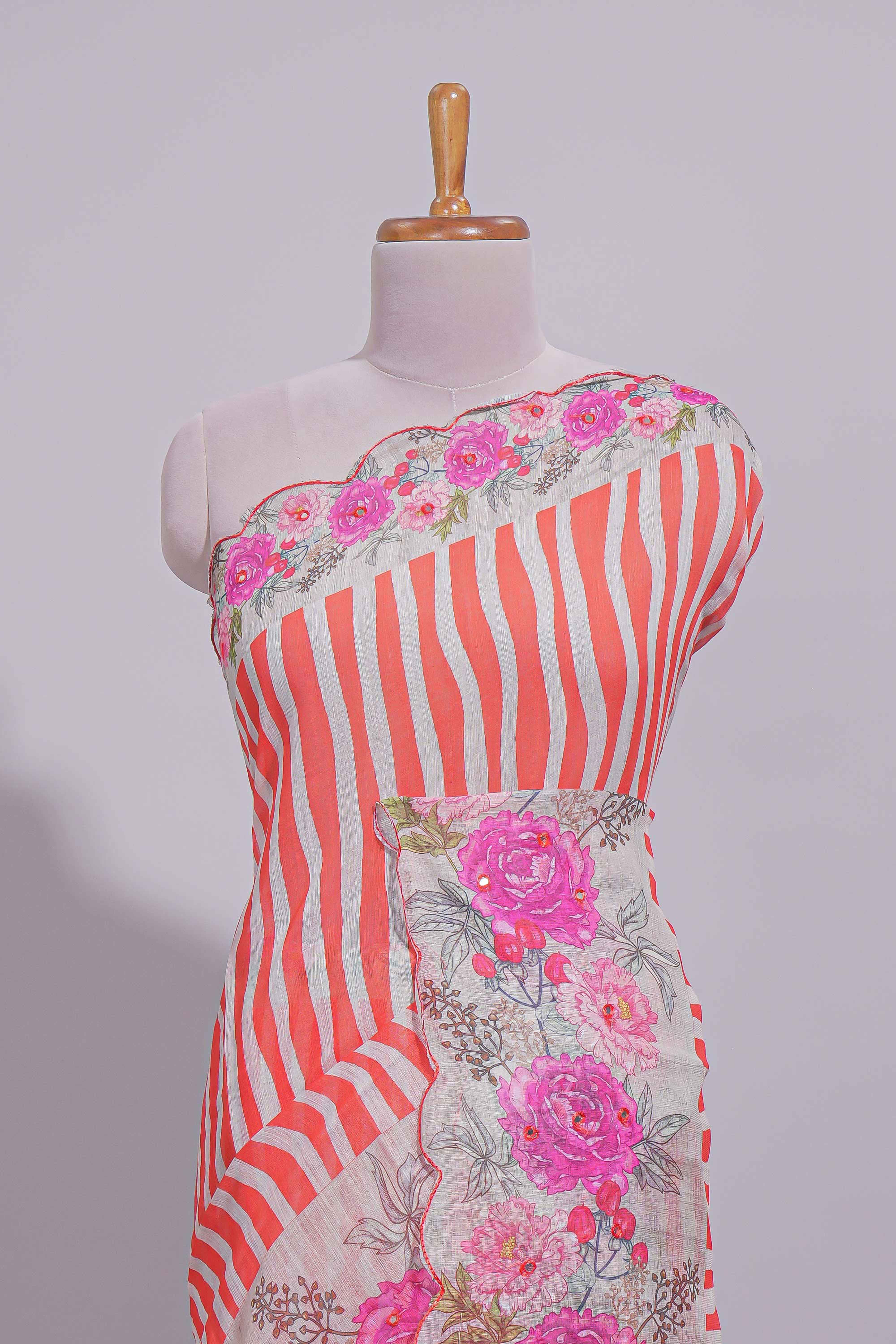 White Linen saree with orange stripes and vibrant pink floral scallop border with contrast printed blouse
