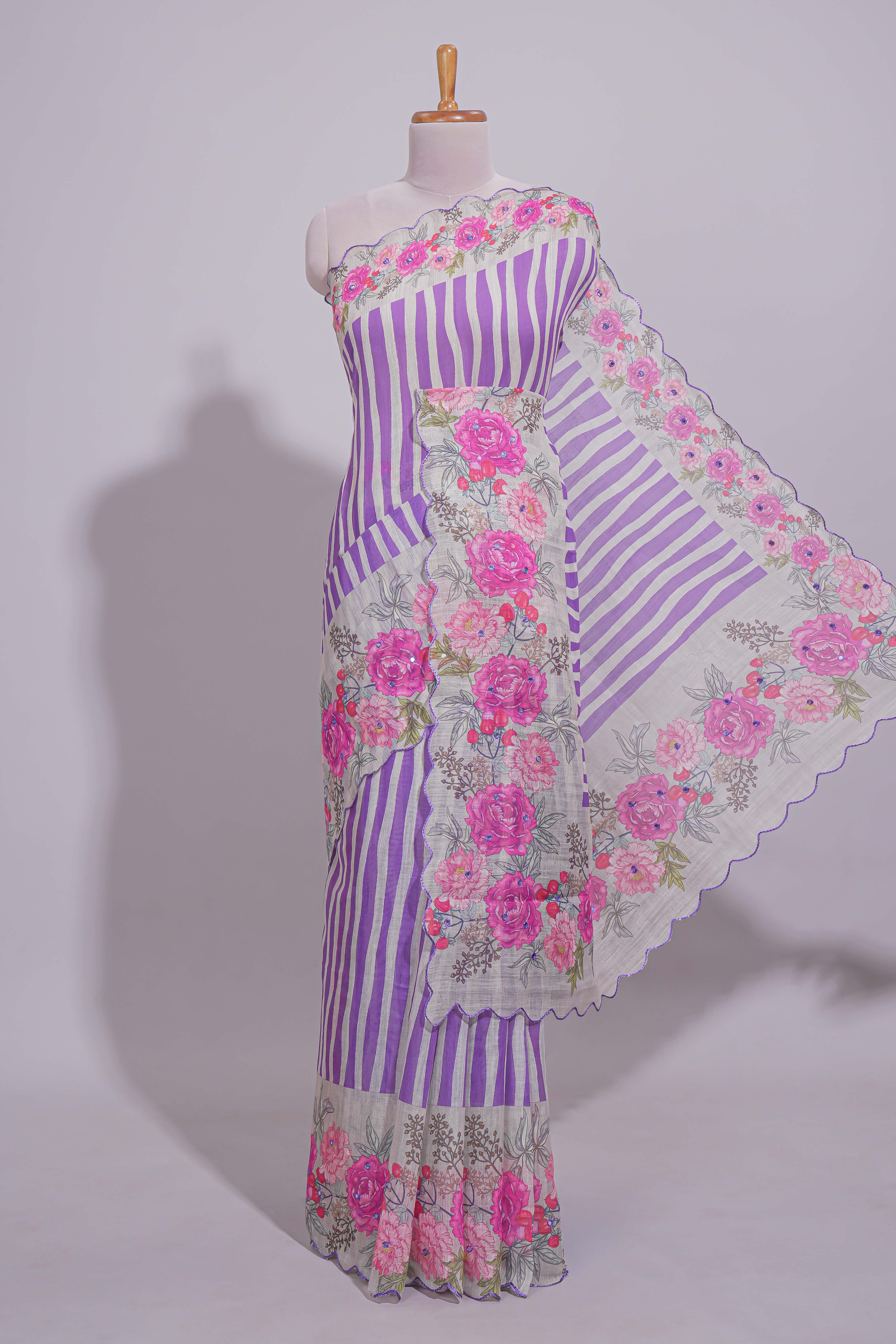 White Linen saree with violet stripes and vibrant pink floral scallop border with contrast printed blouse