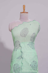 Pastel green linen saree tree motifs and tiny sequin with scalloped border and matching blouse