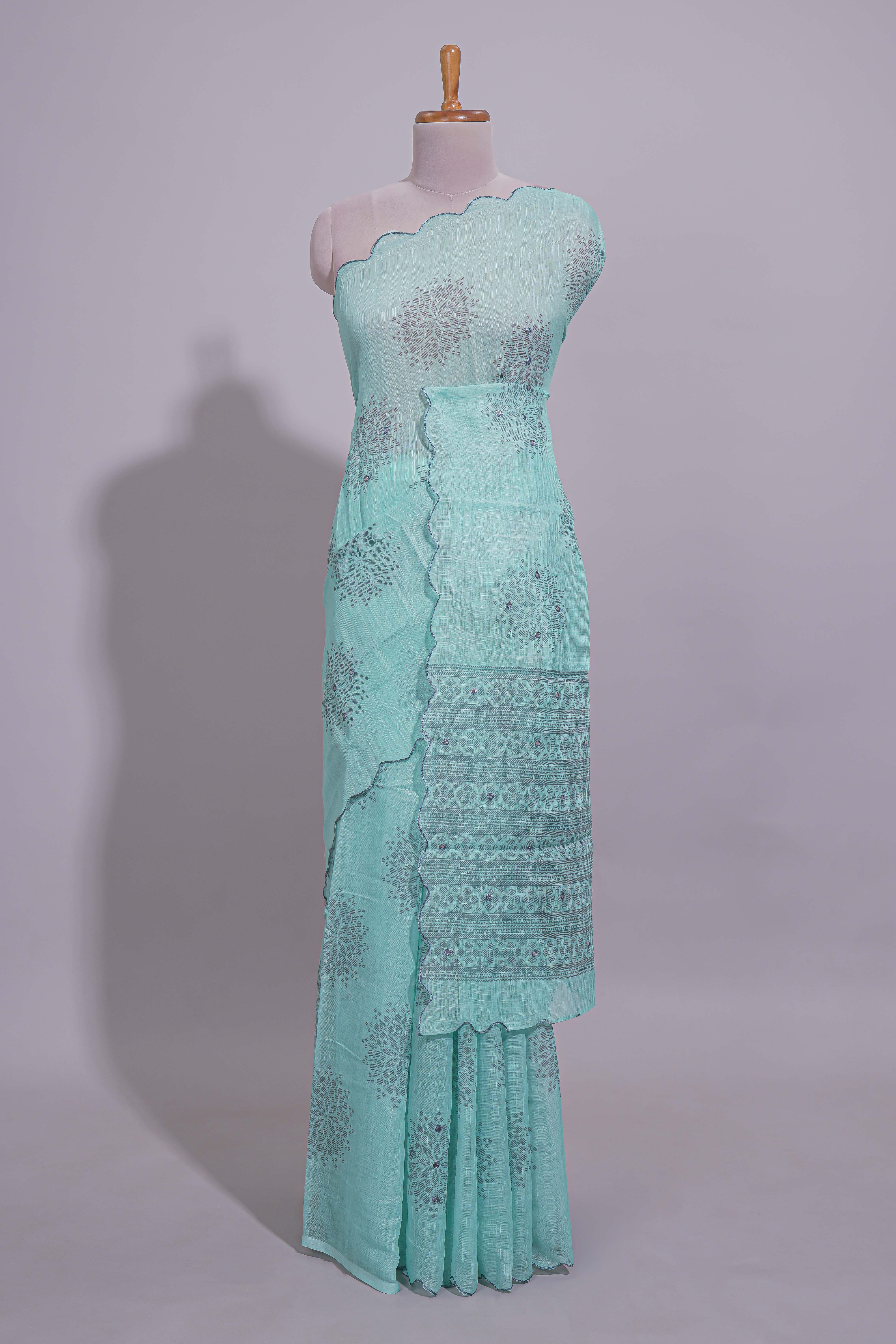 Pastel blue linen saree tree motifs and tiny sequin with scalloped border and matching blouse