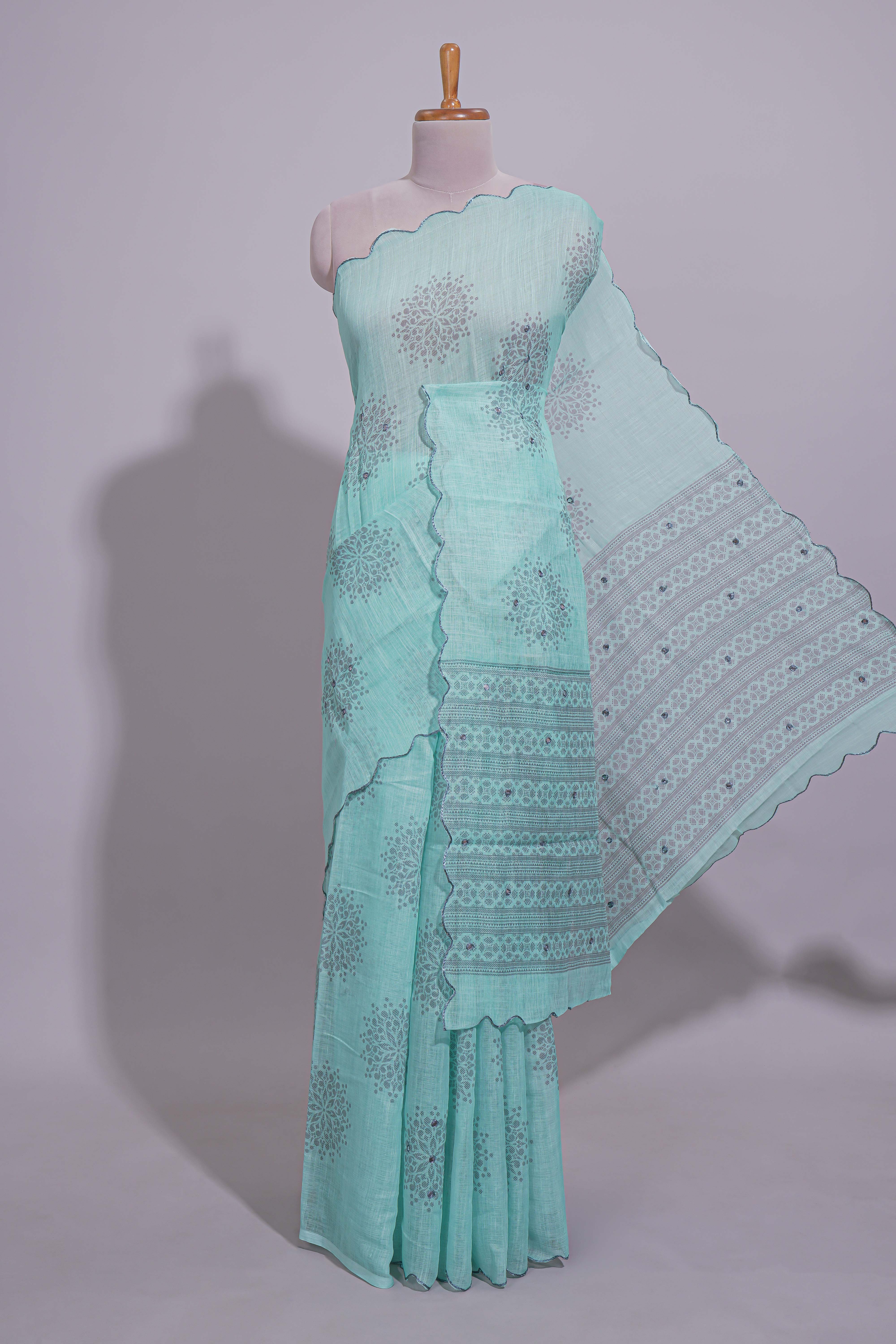 Pastel blue linen saree tree motifs and tiny sequin with scalloped border and matching blouse